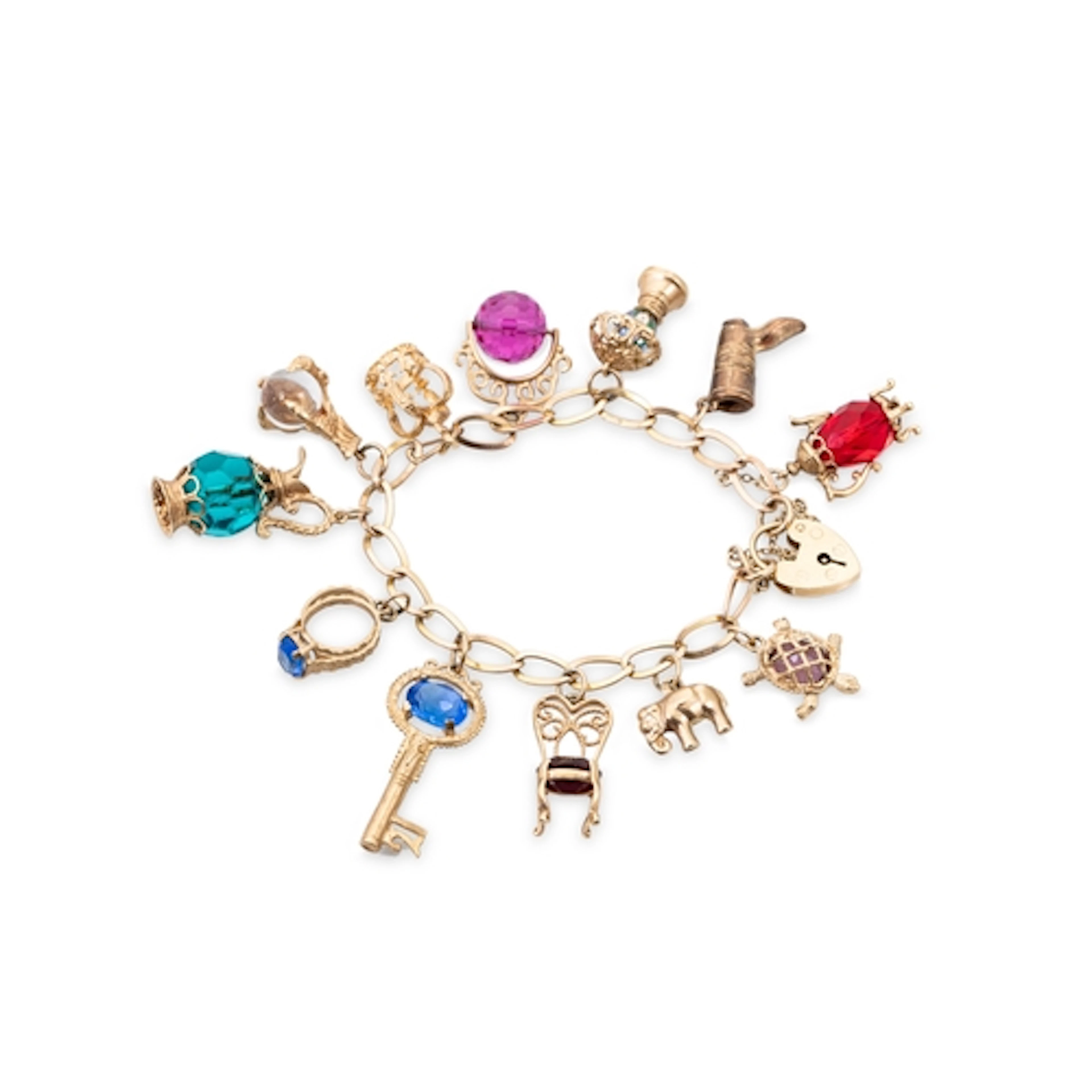 A 9CT GOLD CHARM BRACELET, various charms attached, 40.7 g....