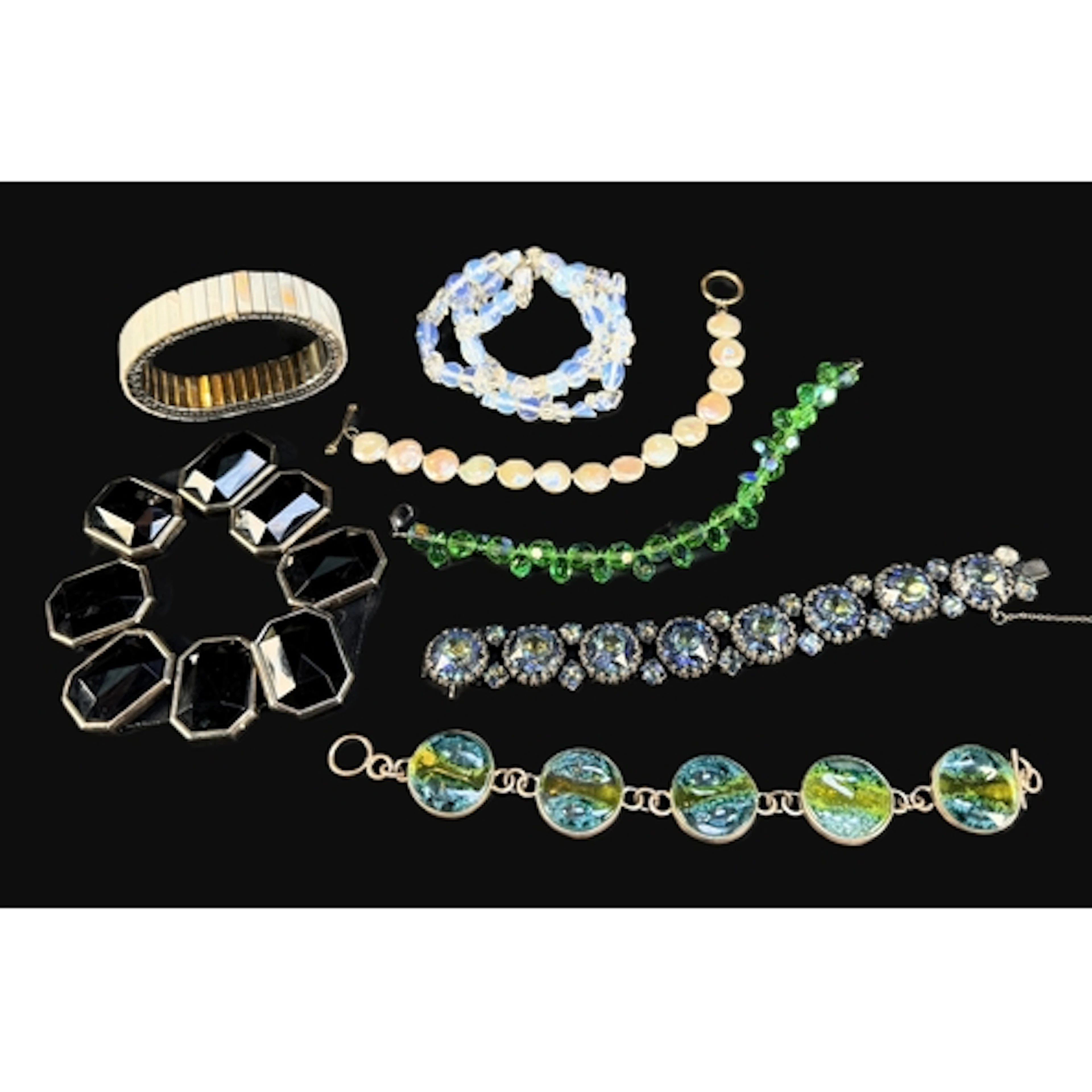 A selection of decorative vintage bracelets, glass beads, gl...