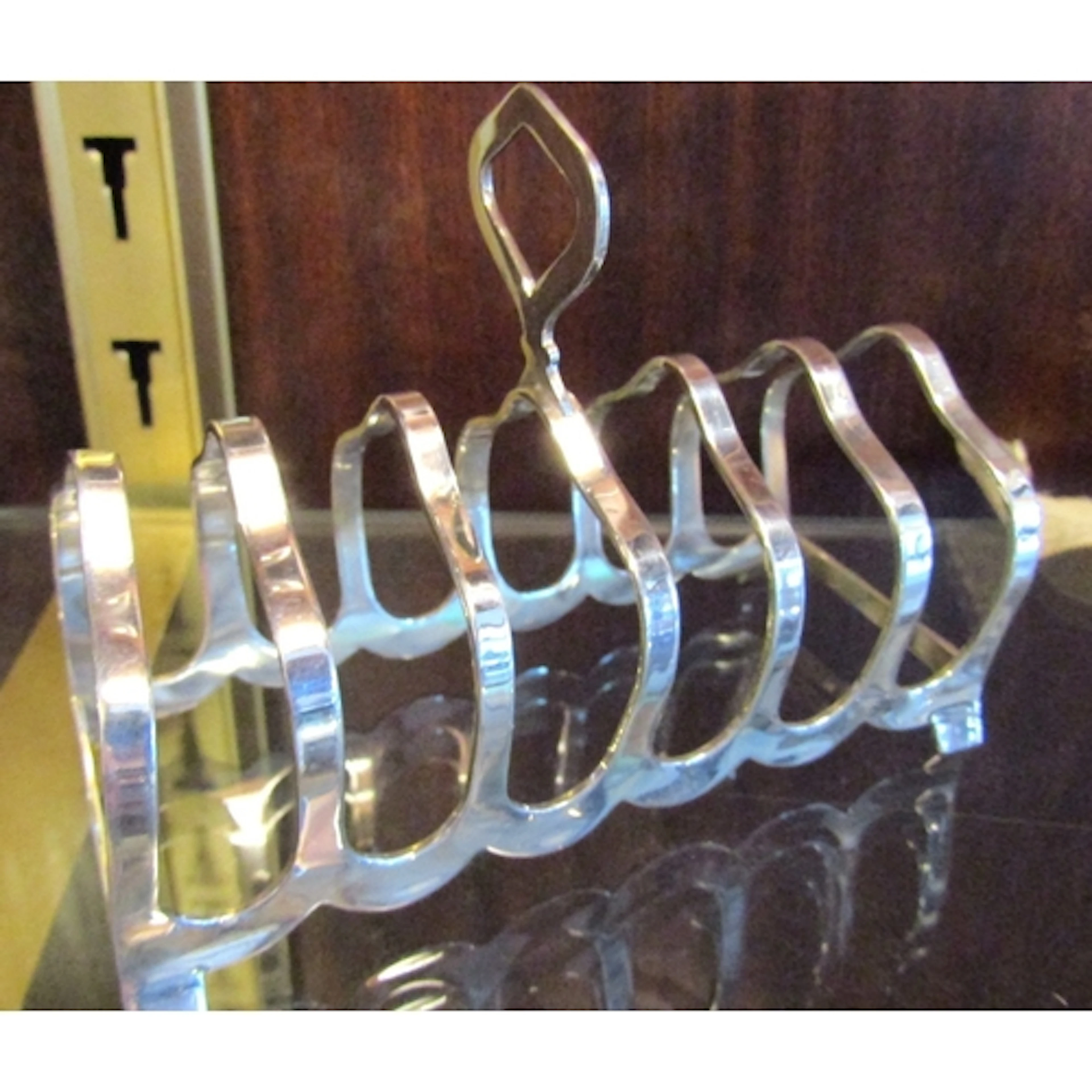 Antique Silver Six Slice Toast Rack Integral Handle Above Sh...