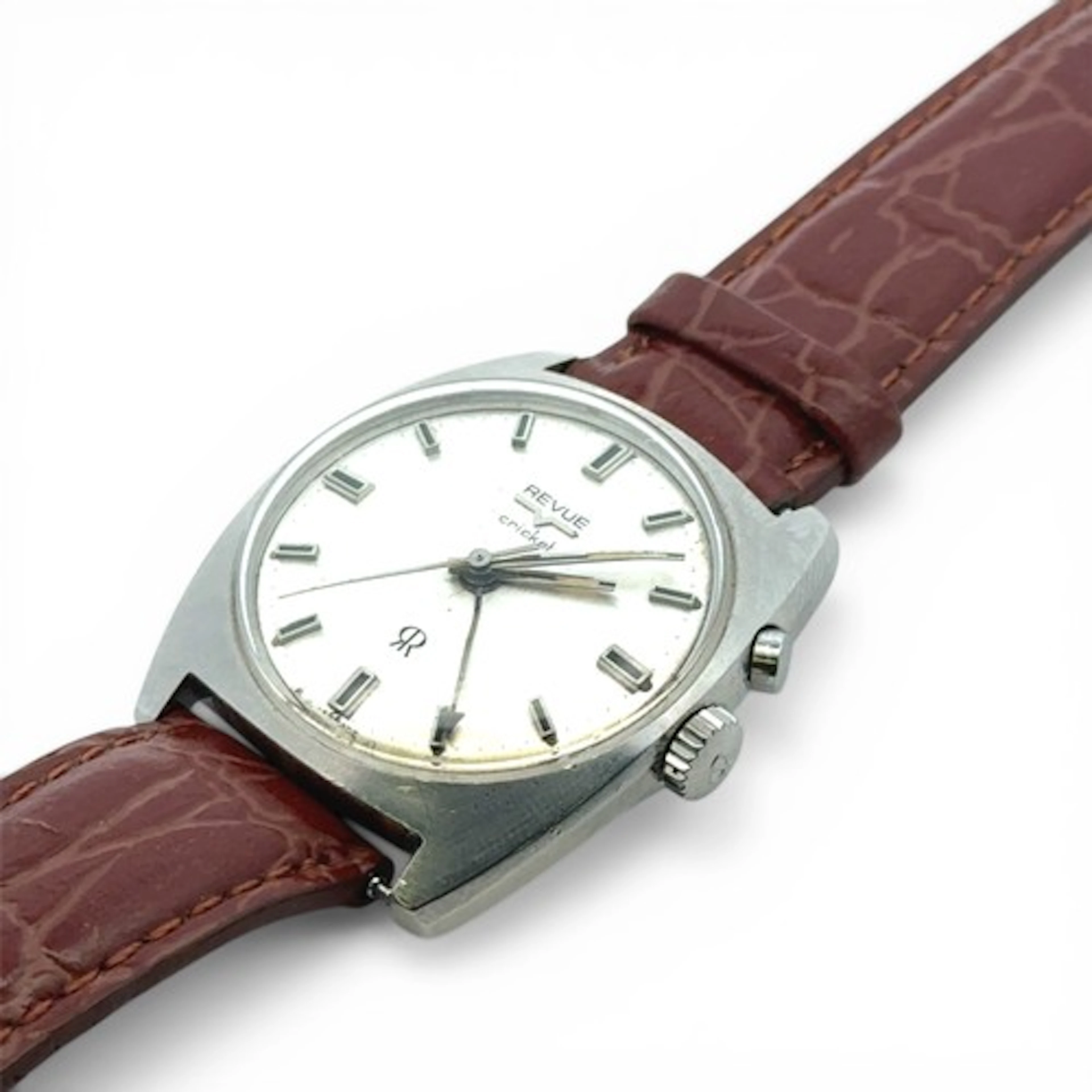 A Revue Cricket alarm watch, silvered dial with baton marker...