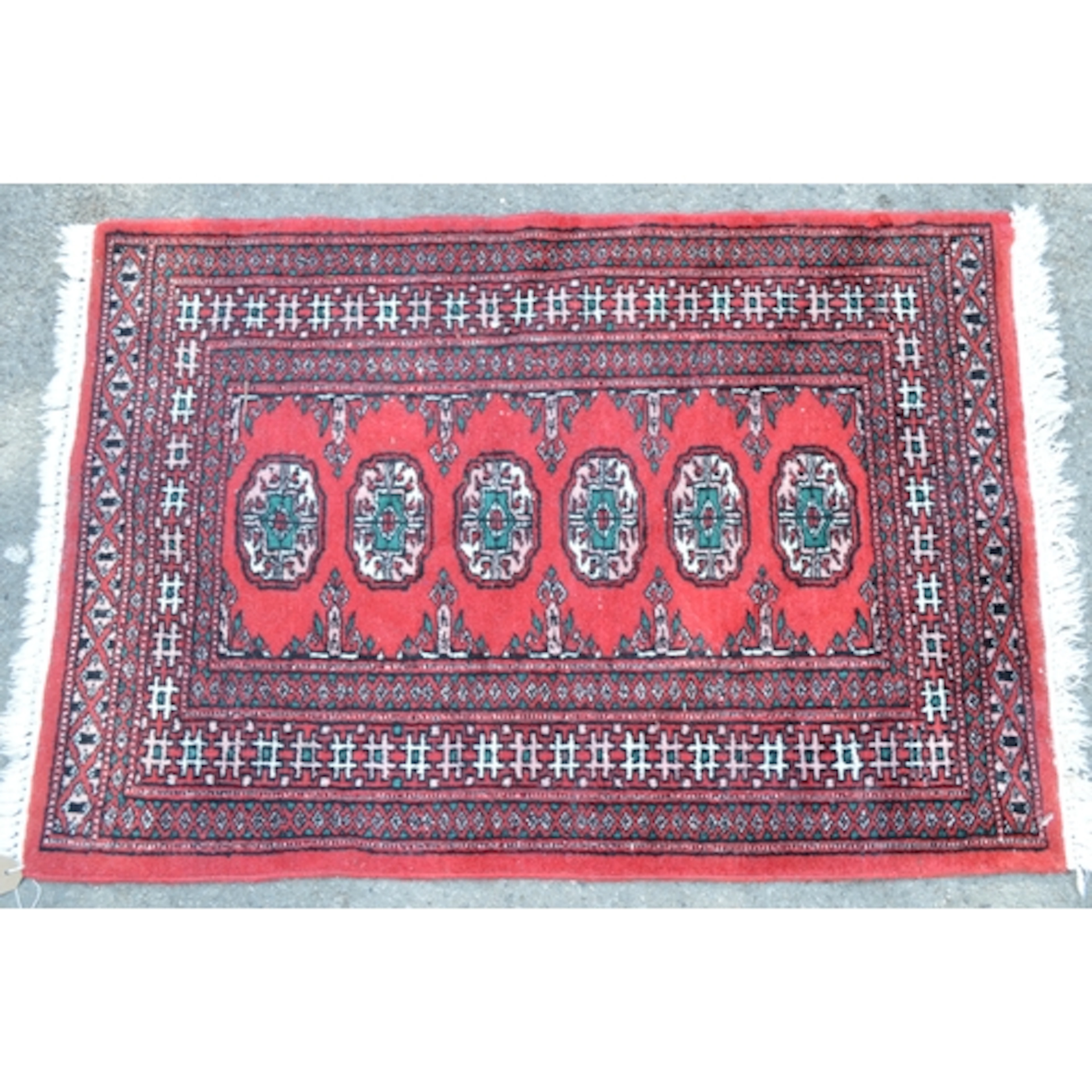 Two small Pakistan Turkoman desig rugs, 60 x 95cm each