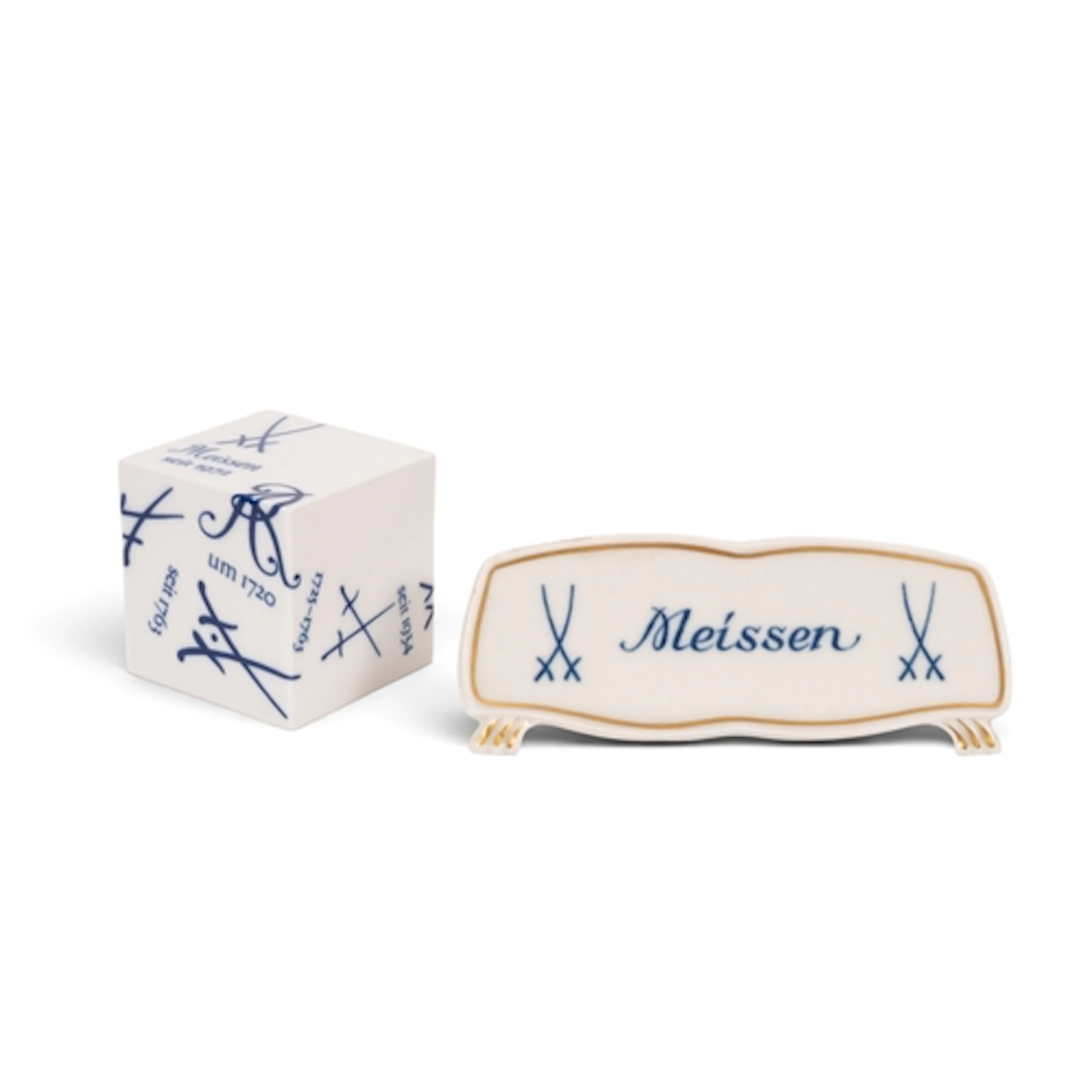 A Meissen shop plaque, 20th century, the shaped form inscrib...