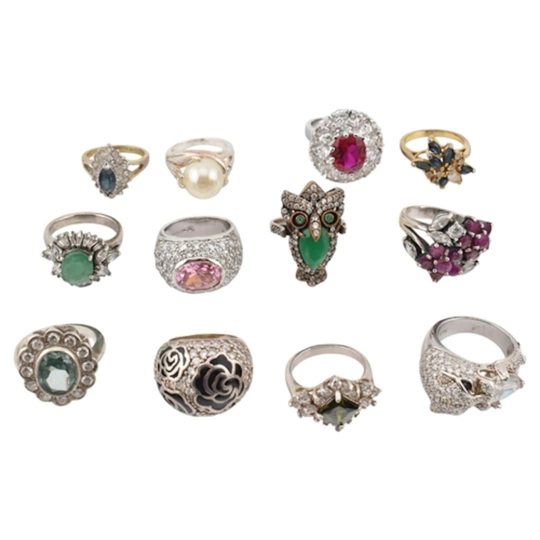 A collection of gem set dress rings. The rings include a CZ,...