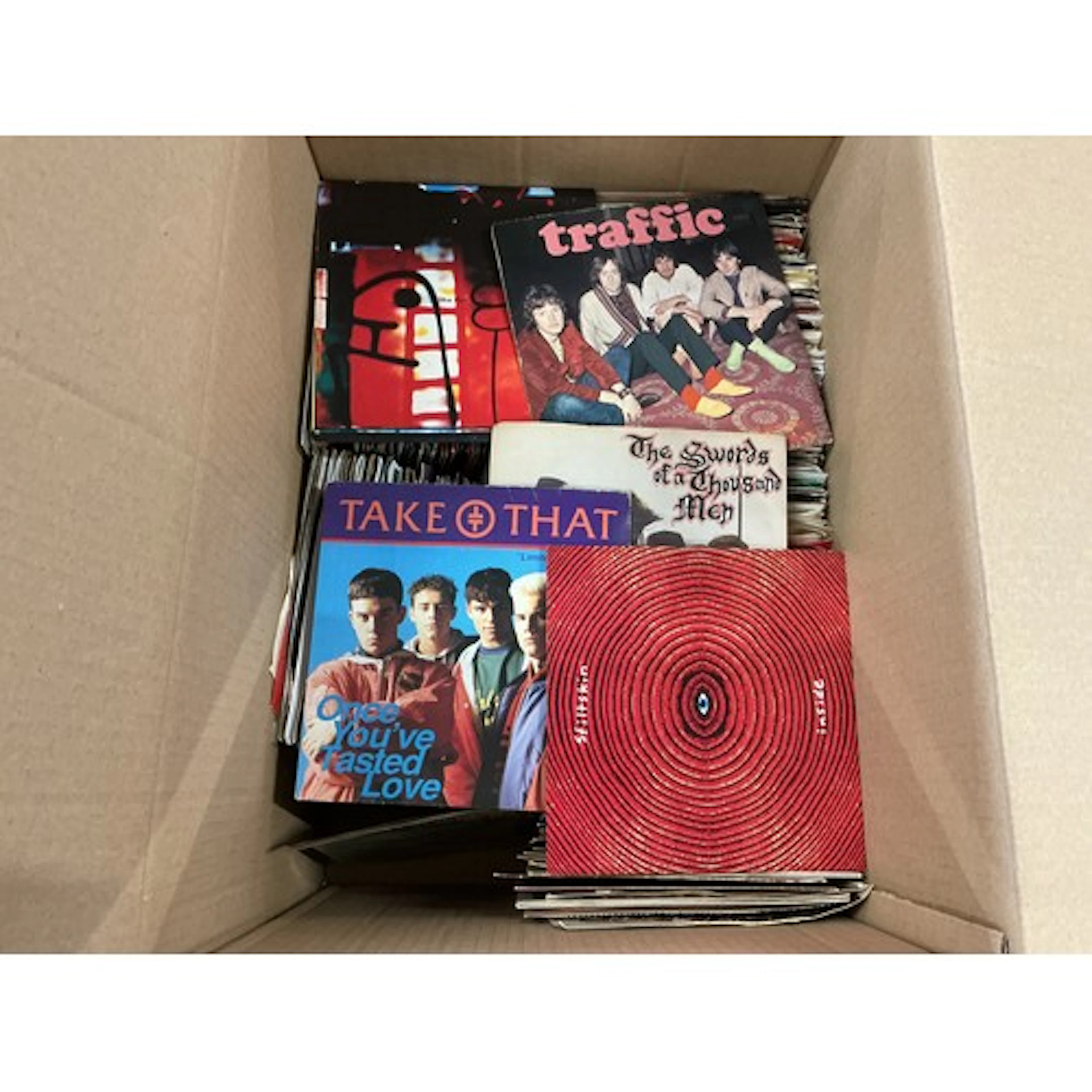Two boxes of 7” singles by various artists including David B...
