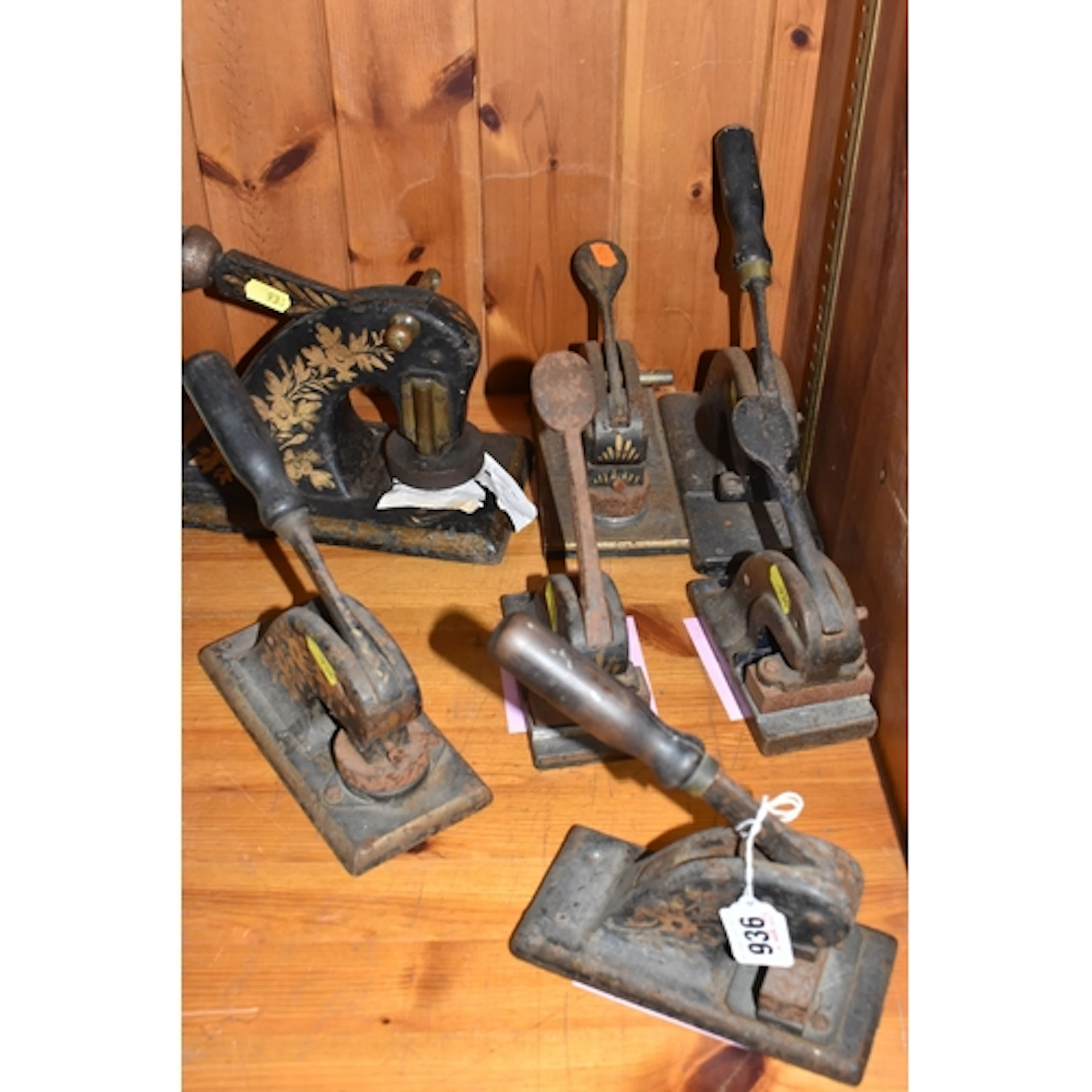 SEVEN VINTAGE EMBOSSING STAMPS, to include a circular stamp ...
