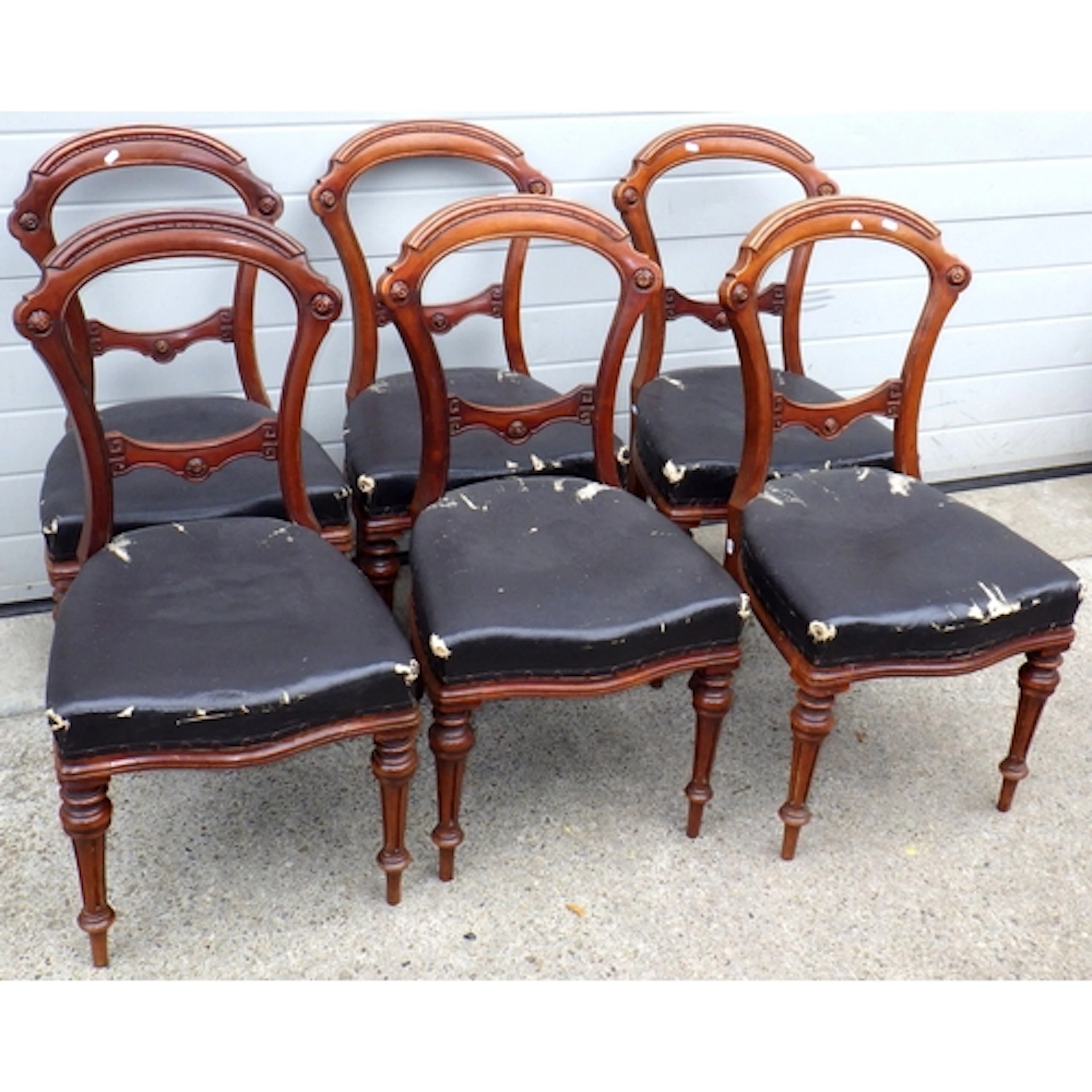 A set of six Victorian mahogany balloon back chairs