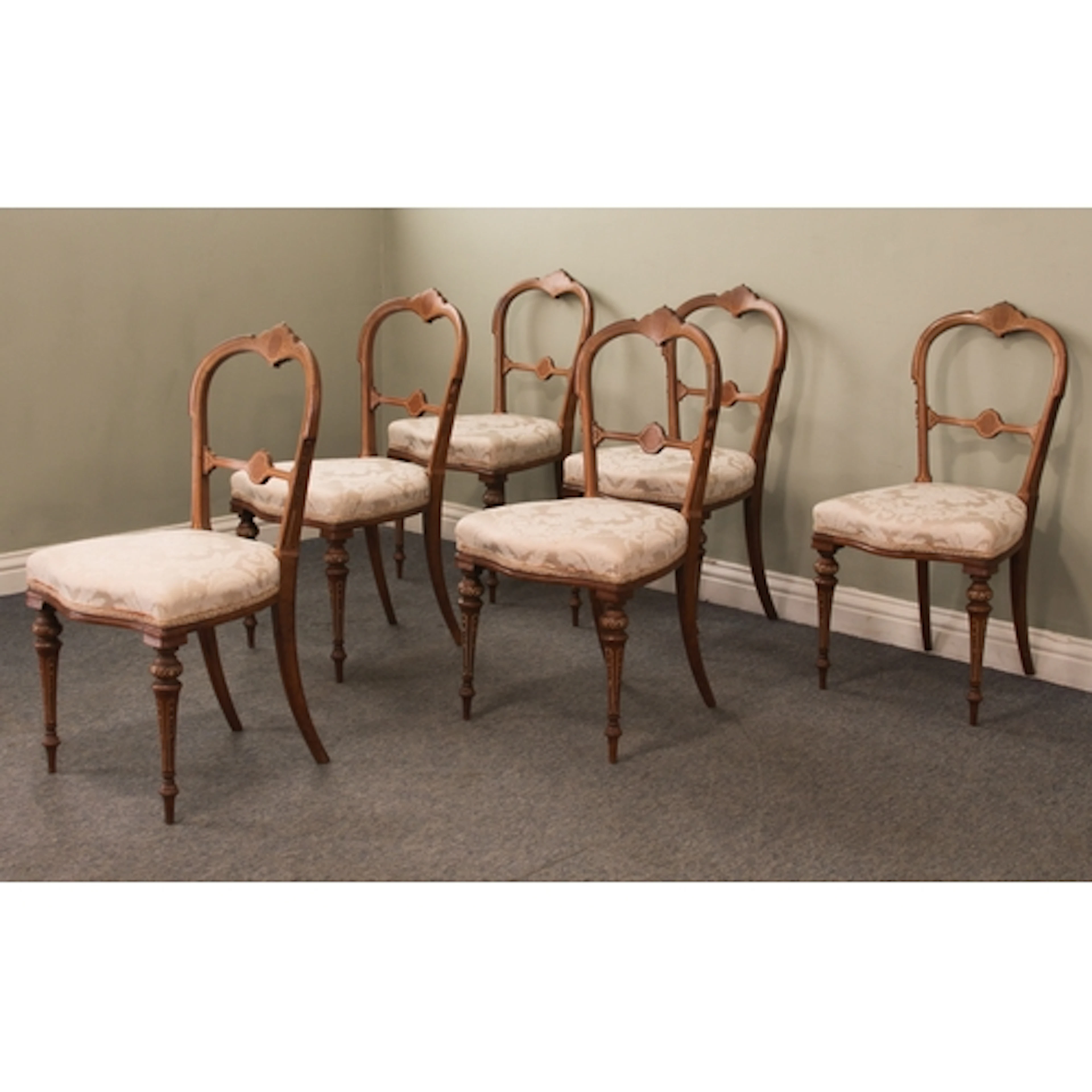 A set of six late-Victorian inlaid walnut dining or salon ch...