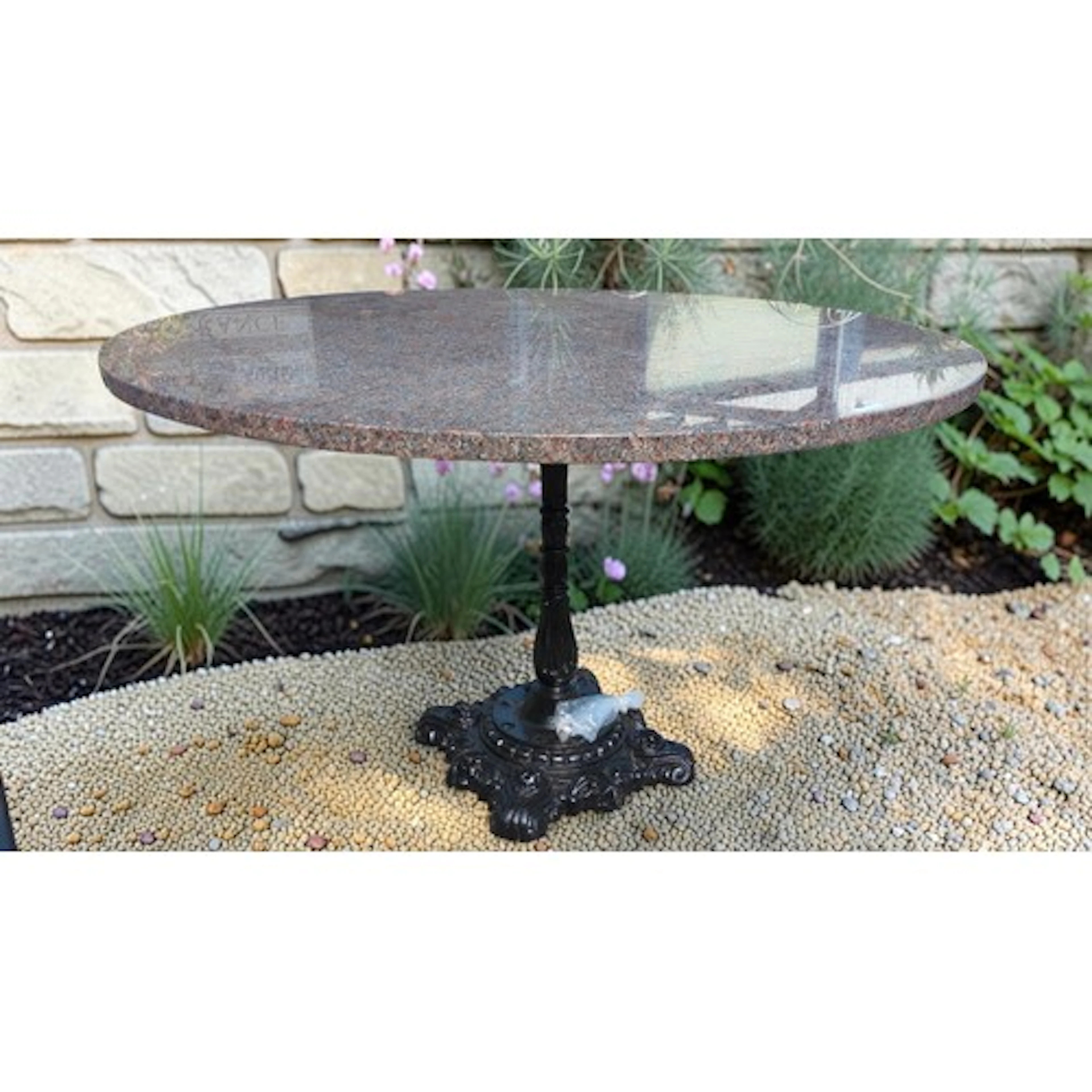 Circular granite-topped pedestal table, on a cast-iron quadr...