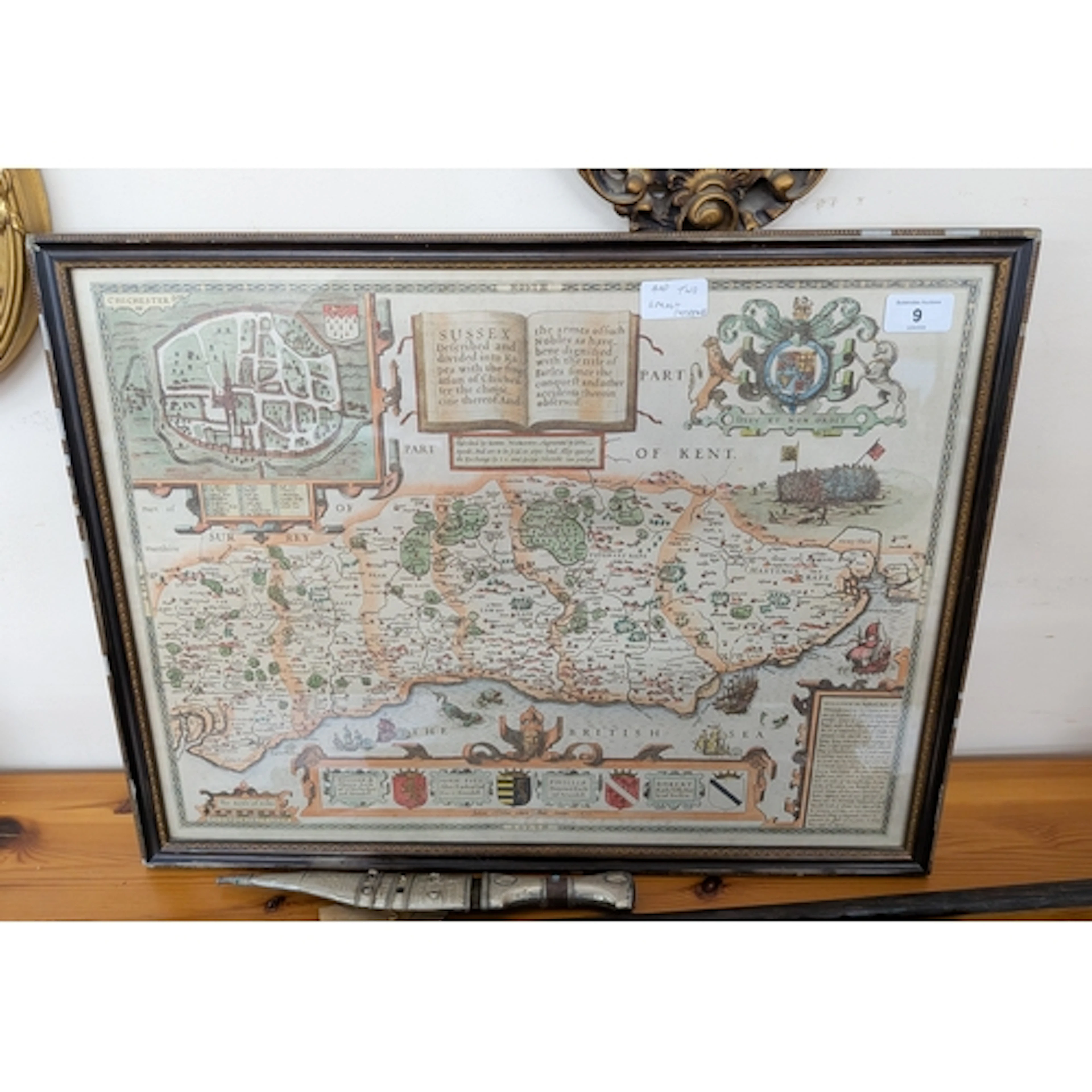 A framed map of Kent together with a shaped gilt framed mirr...