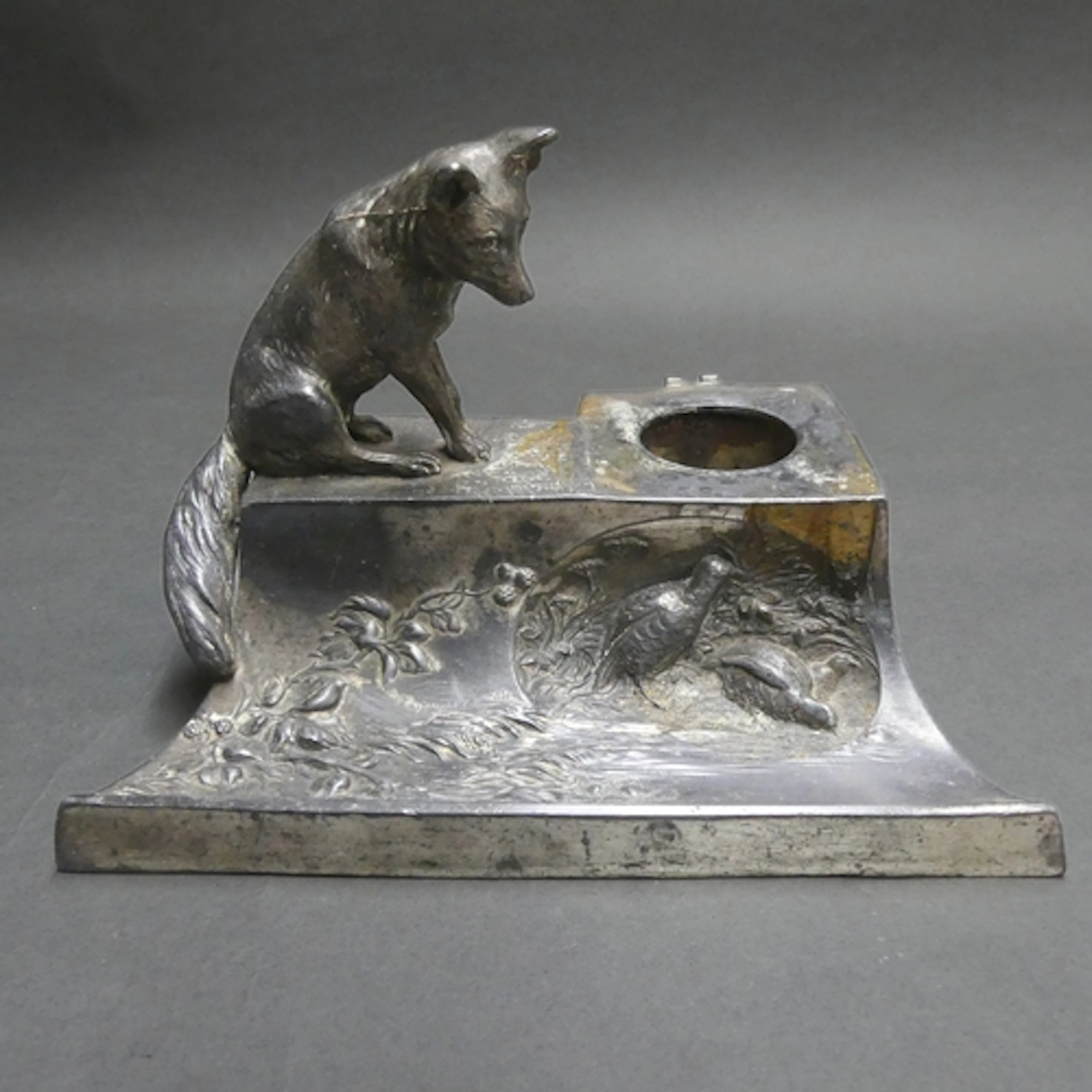 An Art Nouveau pewter desk stand, the cast figural and press...