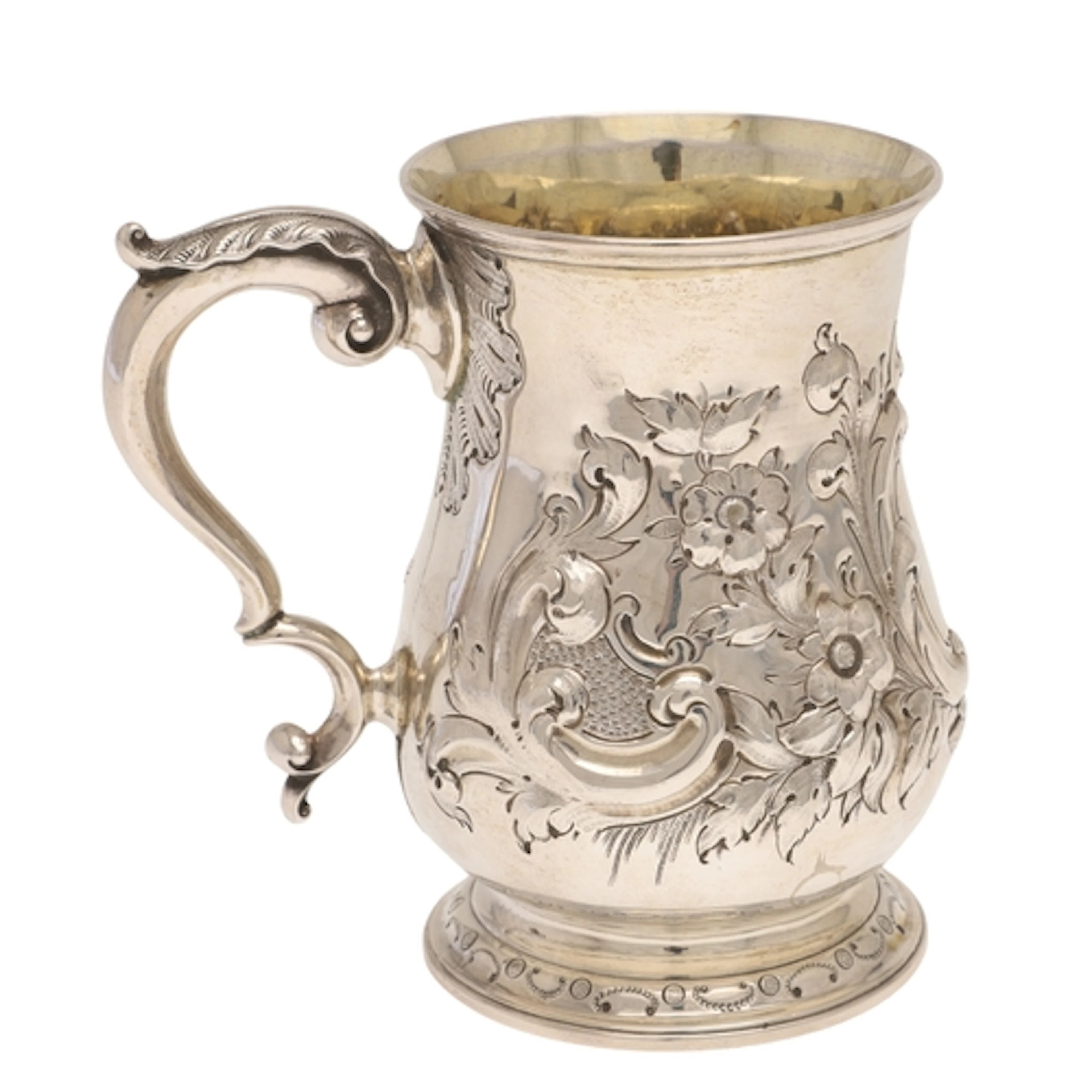 A VICTORIAN SILVER TANKARD. With embossed floral decoration ...