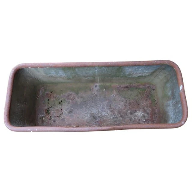 A vintage weathered heavy gauge rectangular trough with pop ...