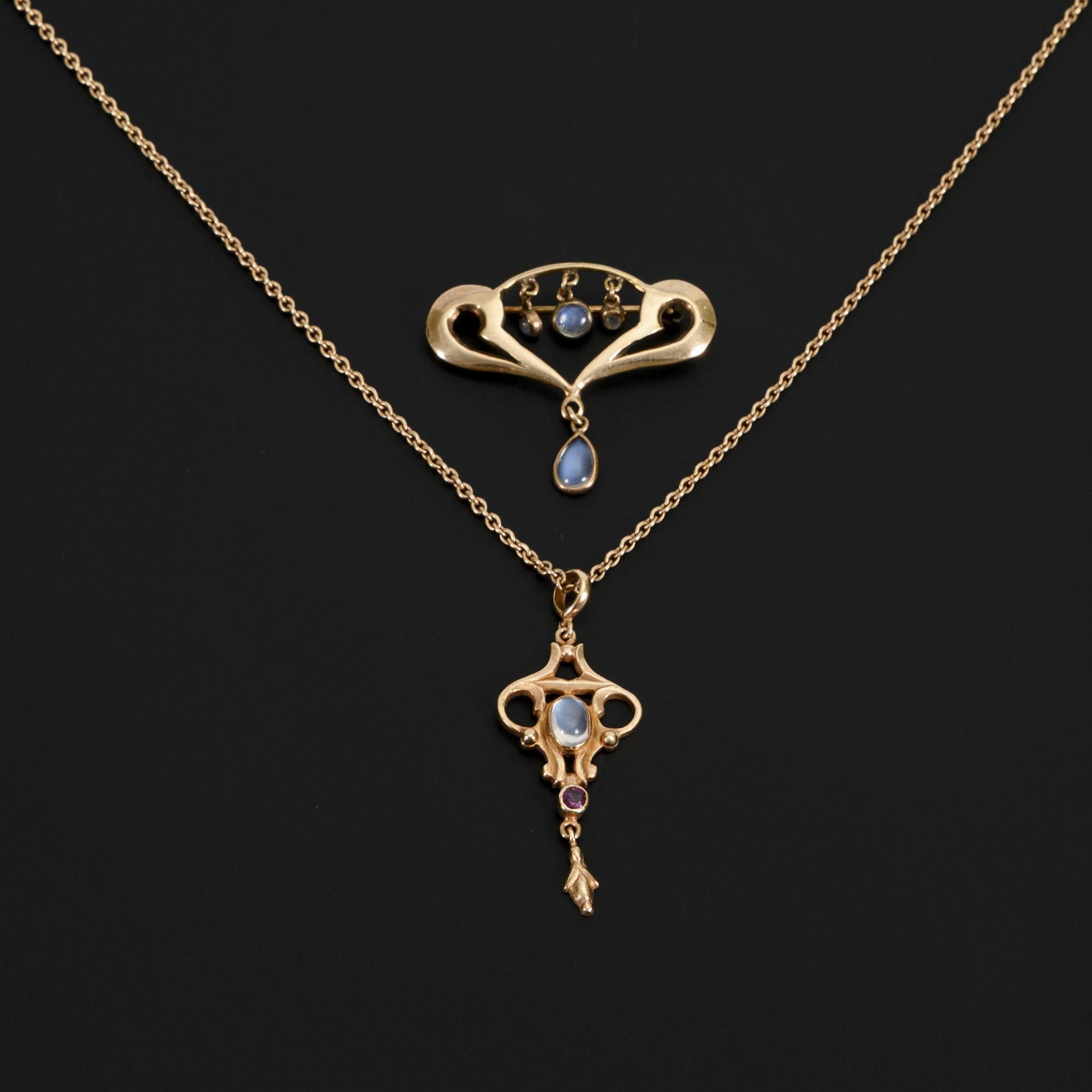 Brooch and necklace with moonstone cabochons.
