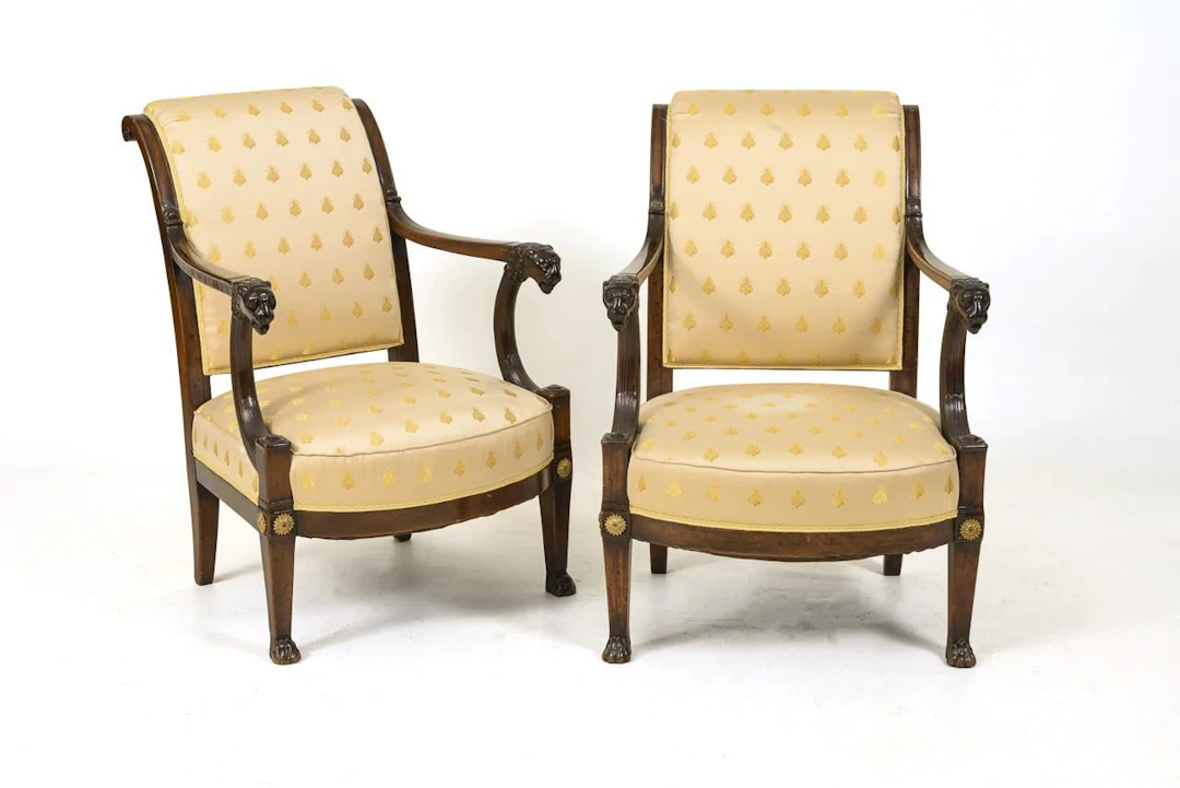 2 French armchairs with lion heads.