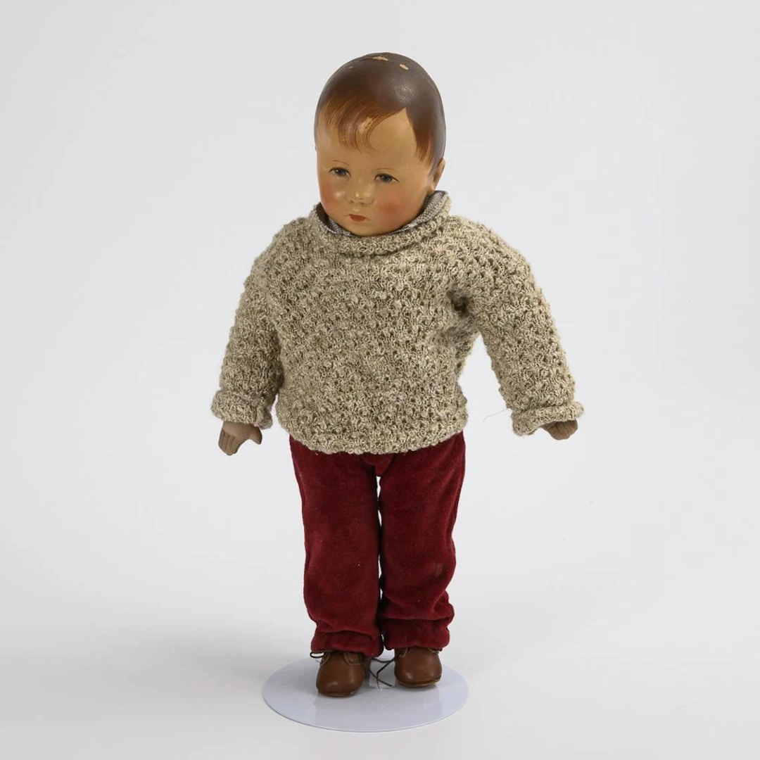 Boy doll with wine-red pants. Käthe Kruse.