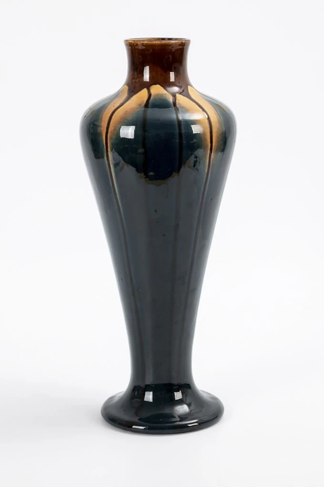 Large Art Nouveau vase with run glaze.
