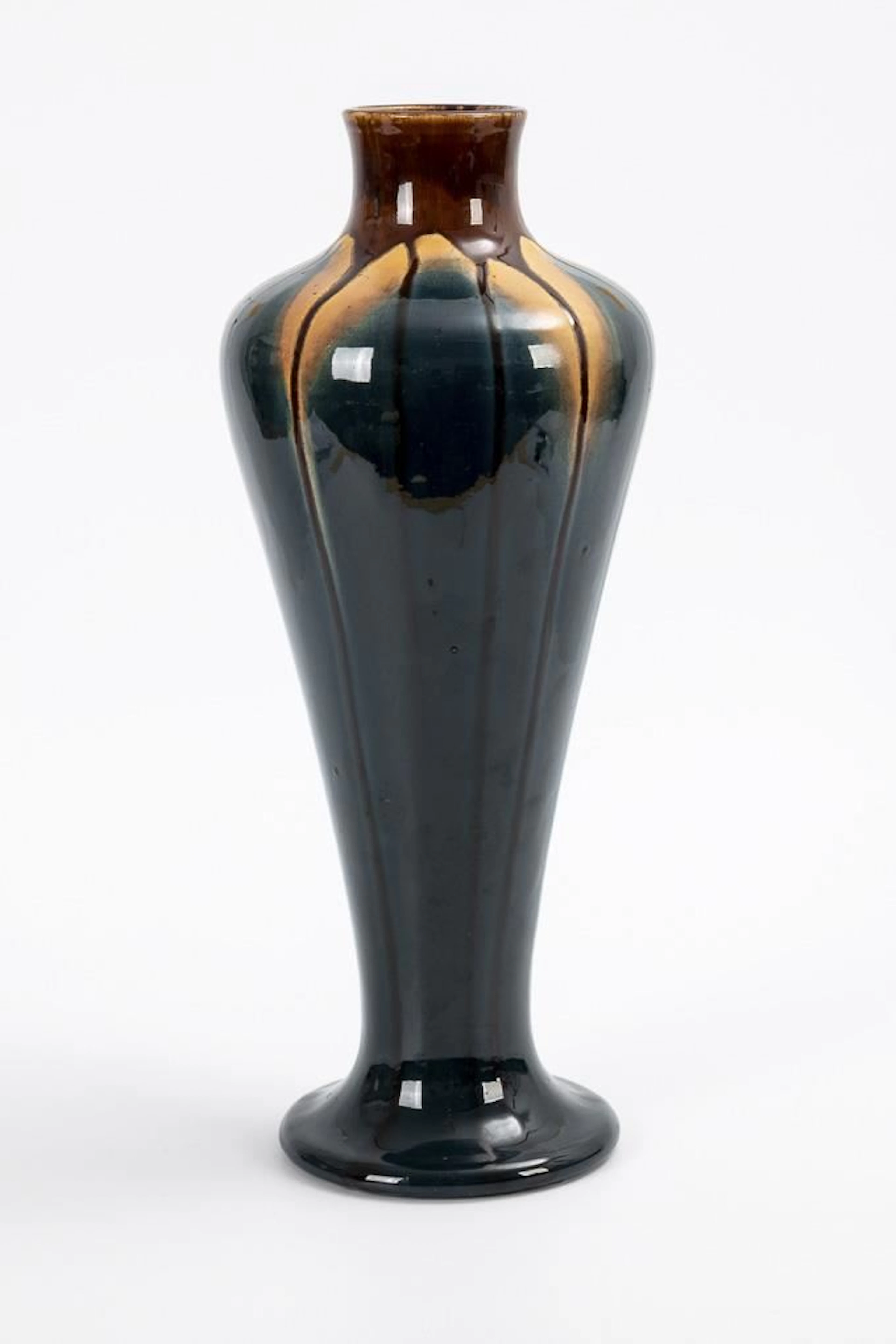 Large Art Nouveau vase with run glaze.