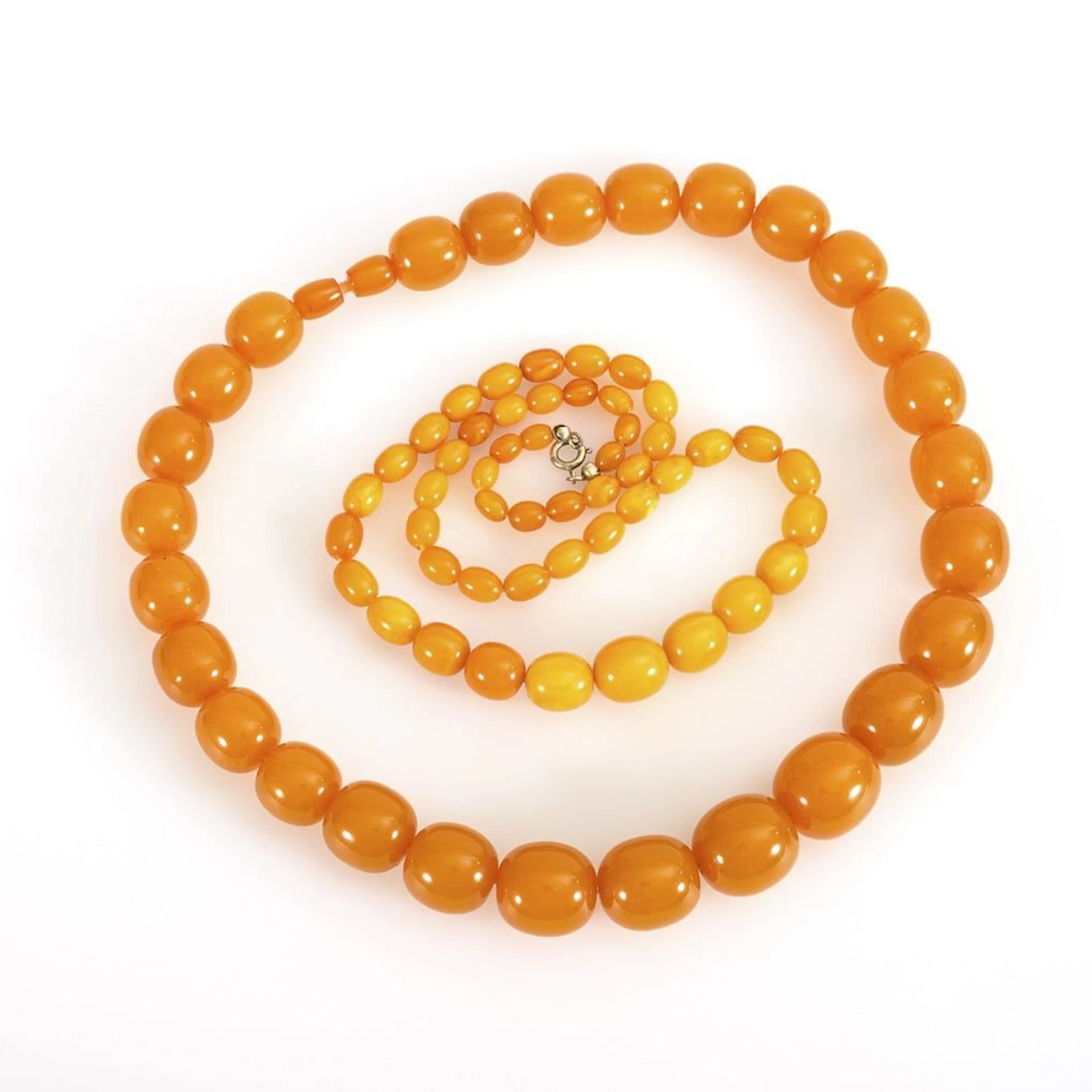 2 amber necklaces.