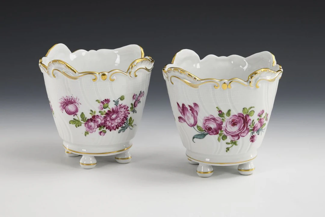 2 cachepots with floral designs. Potschappel.
