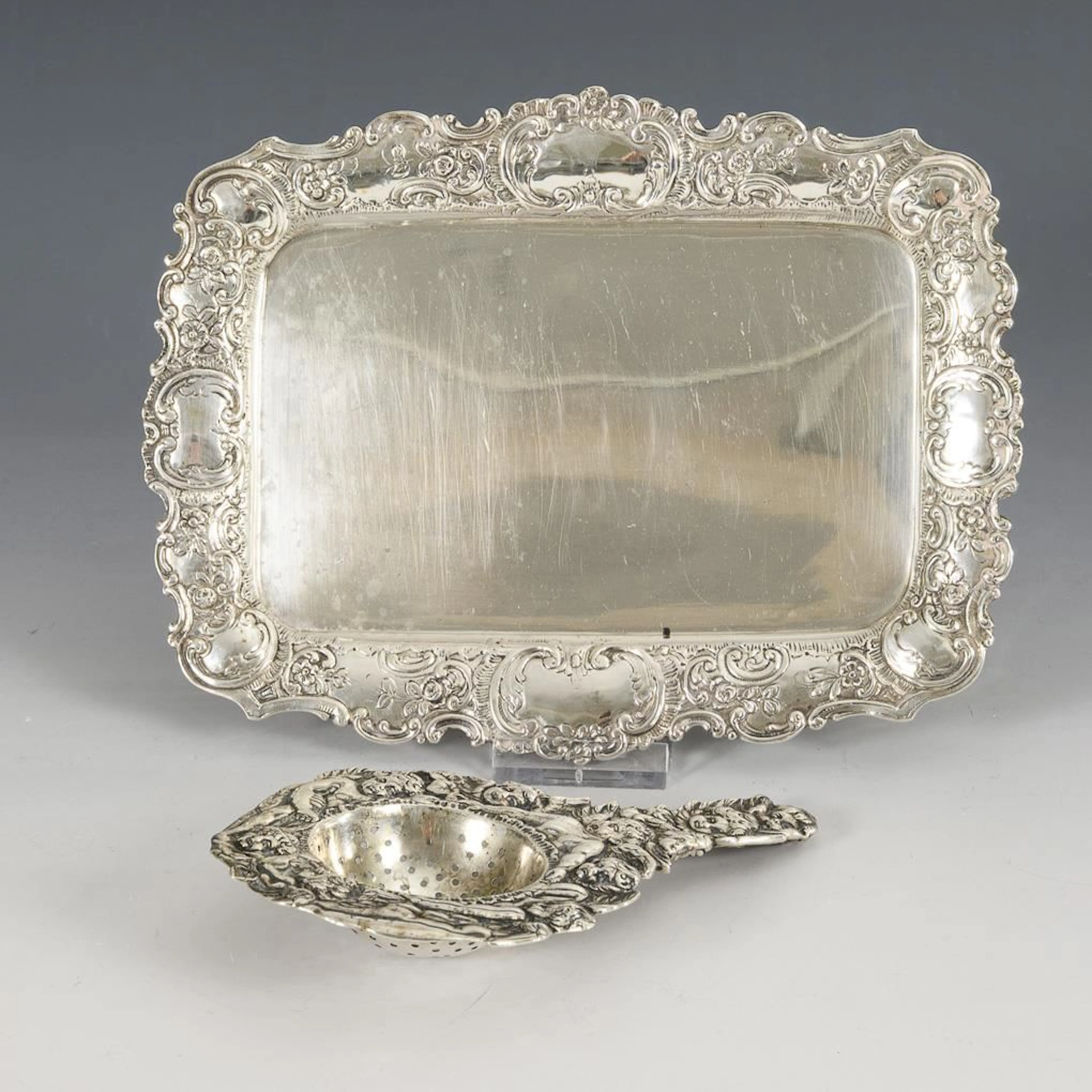 Small silver tray and tea strainer.