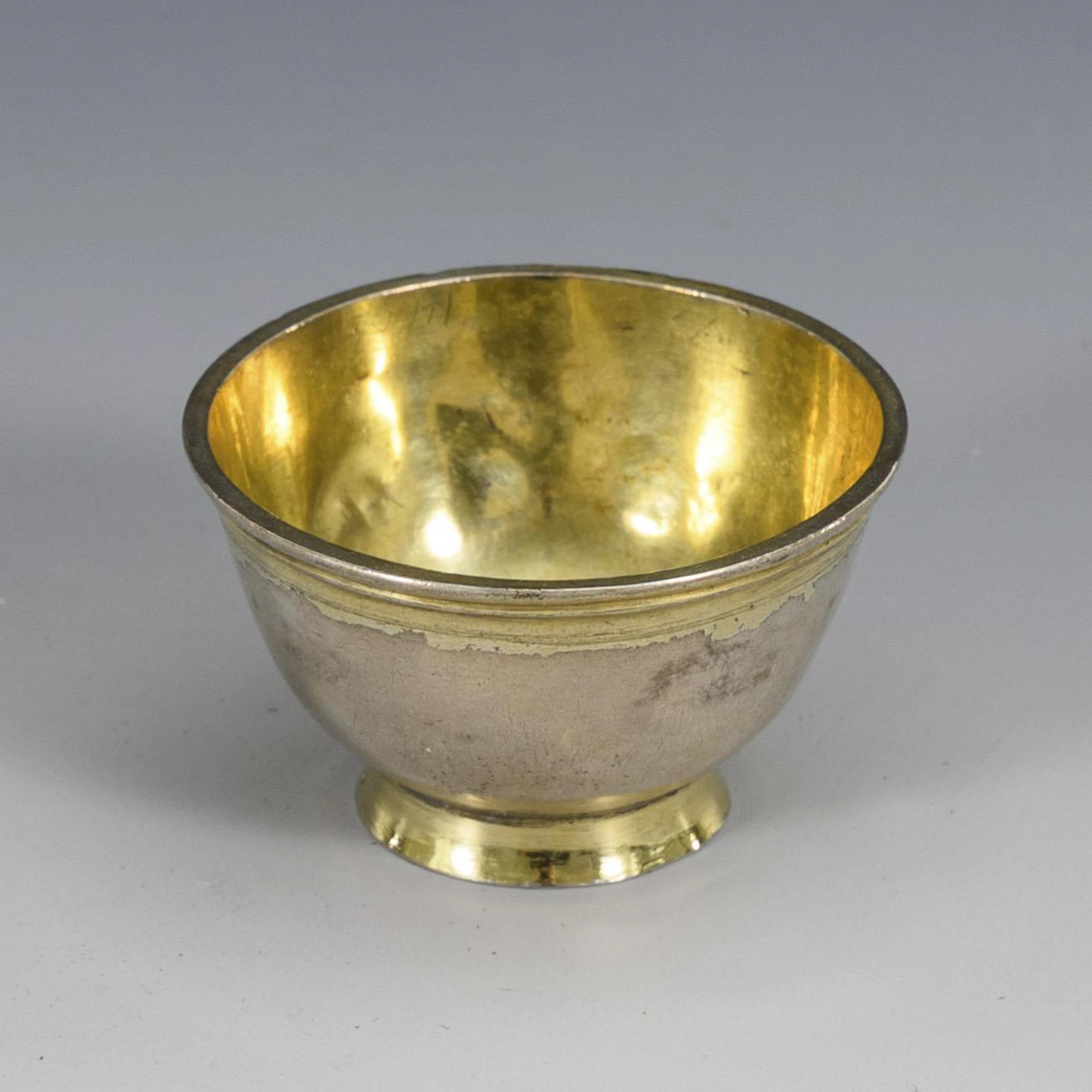 Baroque silver bowl with coin base.