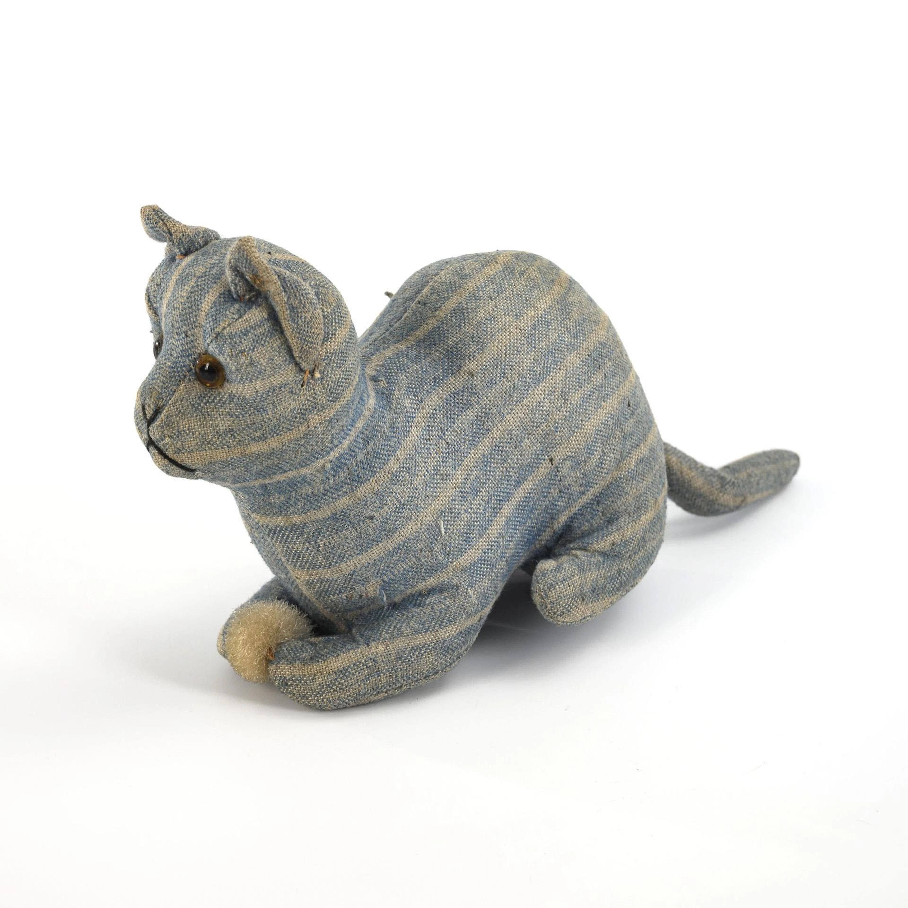 Fabric cat with plush ball.