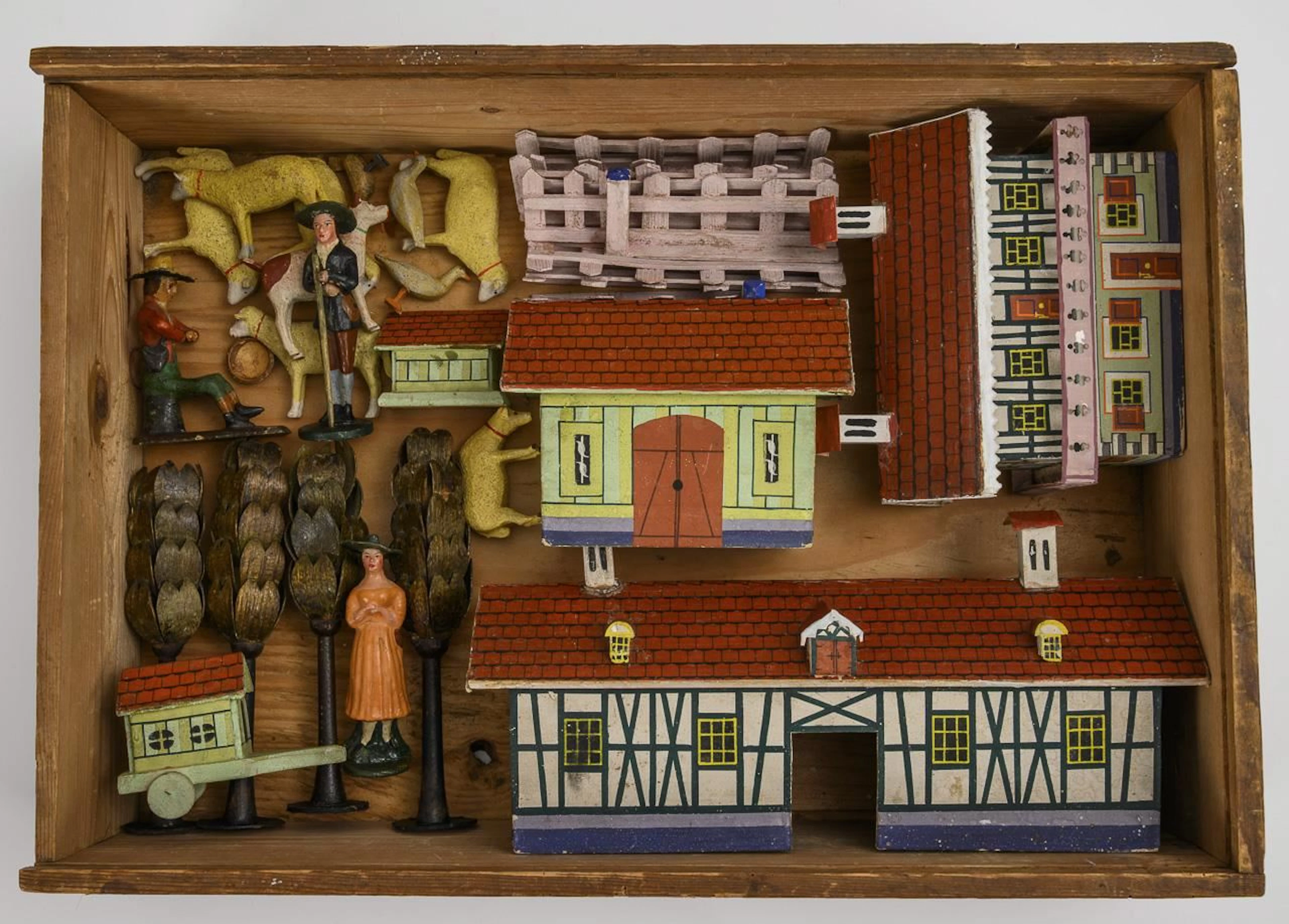 A rare box featuring houses, animals, and figures—“Sheep Farm.”