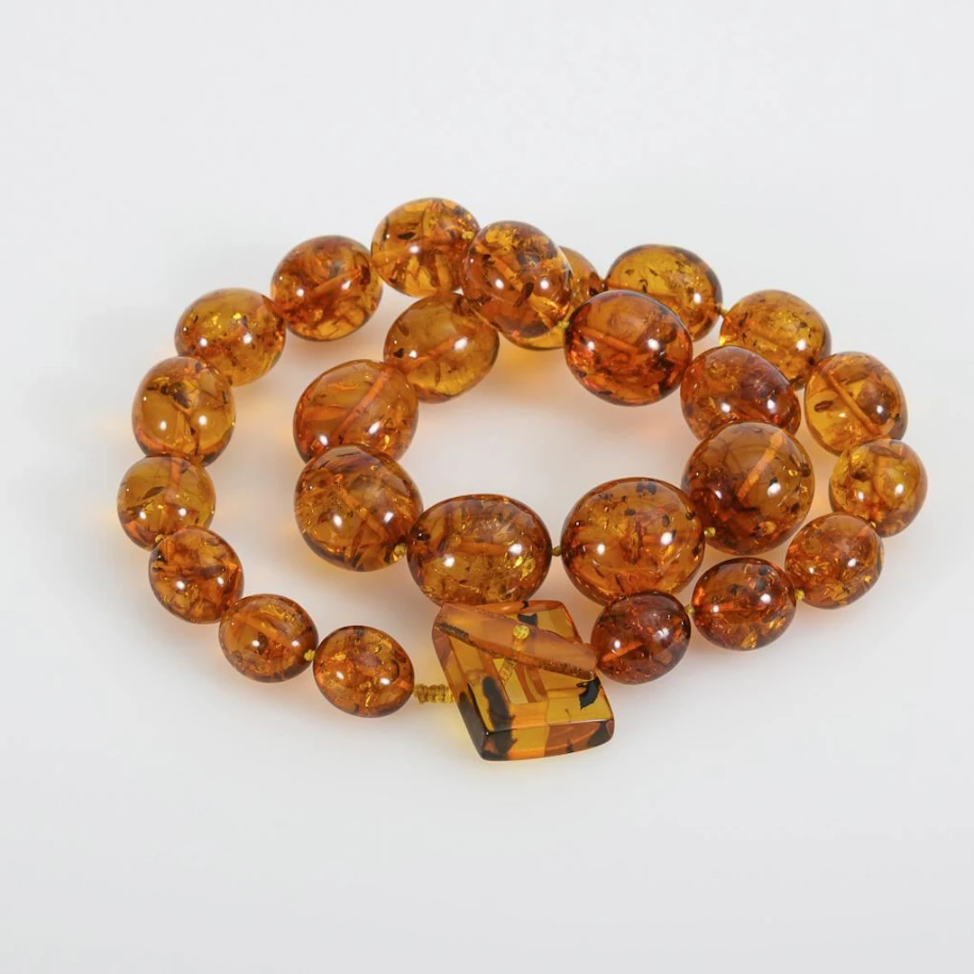 Necklace with exceptionally large olive-shaped beads made of genuine