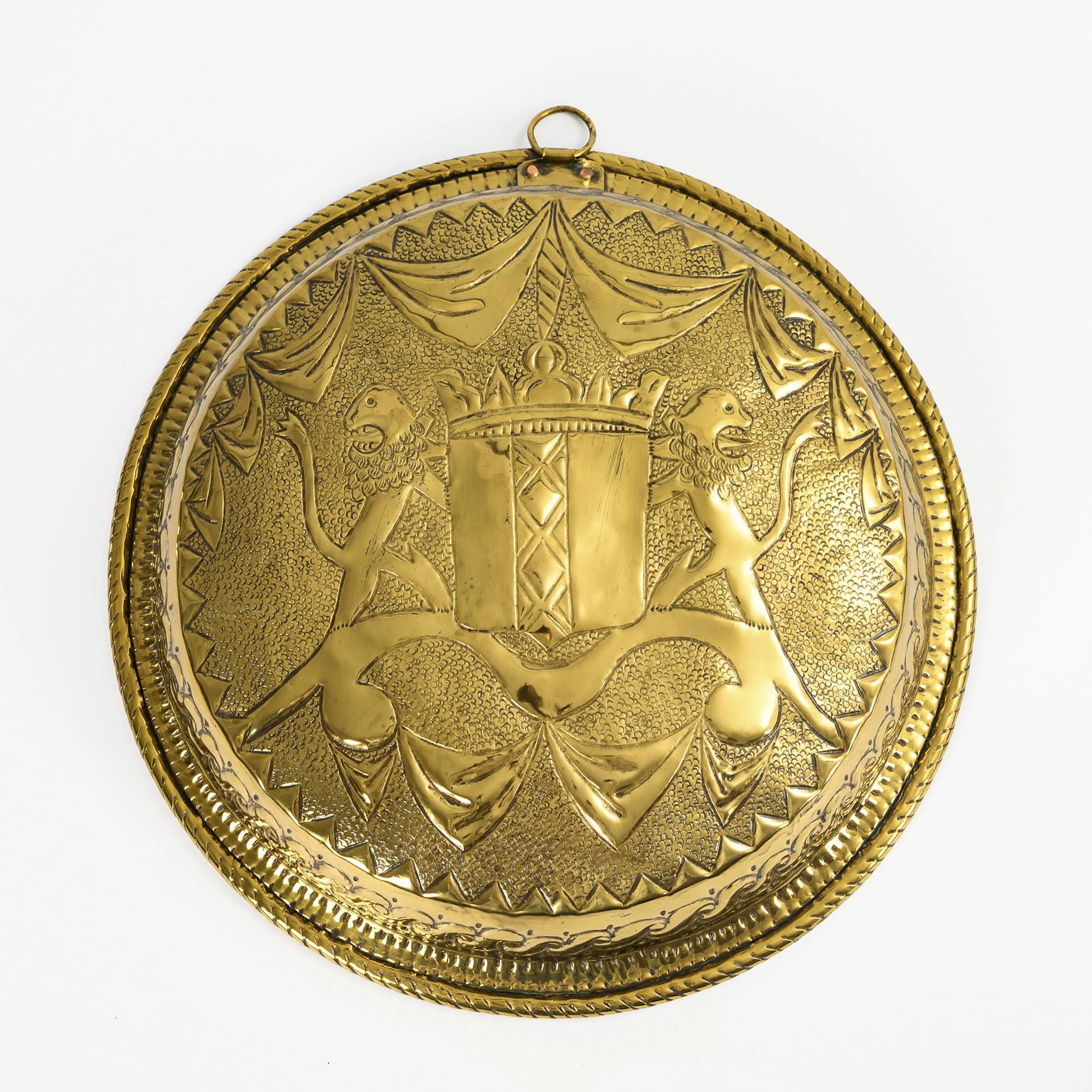 Large decorative bowl with coat of arms.