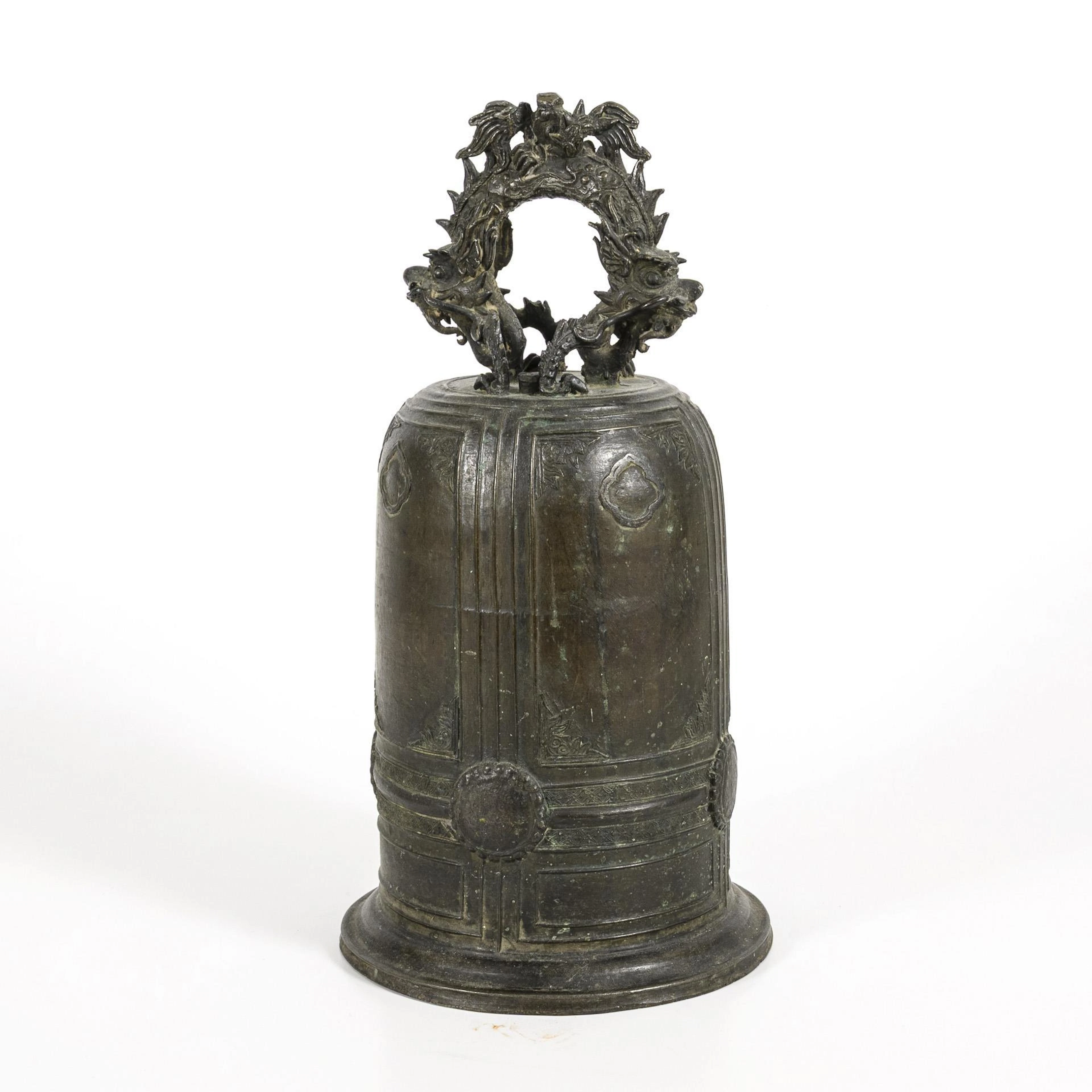Large bronze bell with dragon handle.