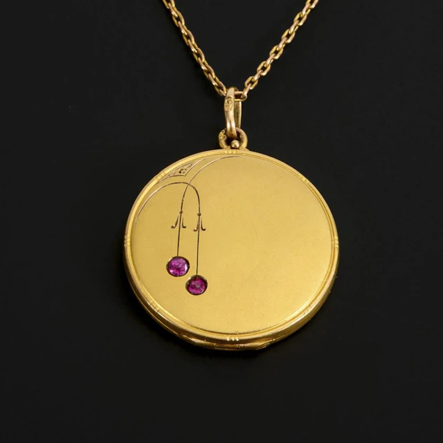 Art Nouveau medallion on a chain.