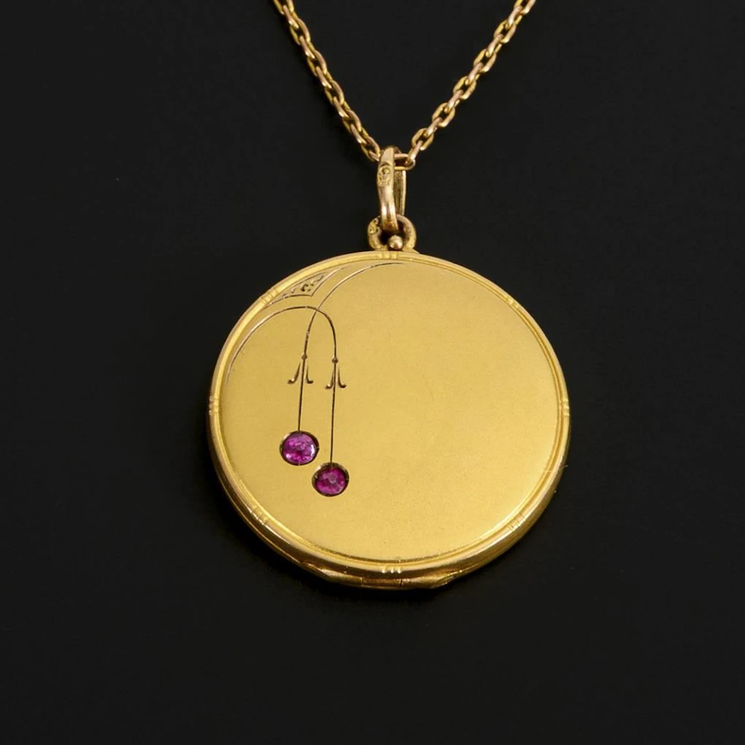 Art Nouveau medallion on a chain.