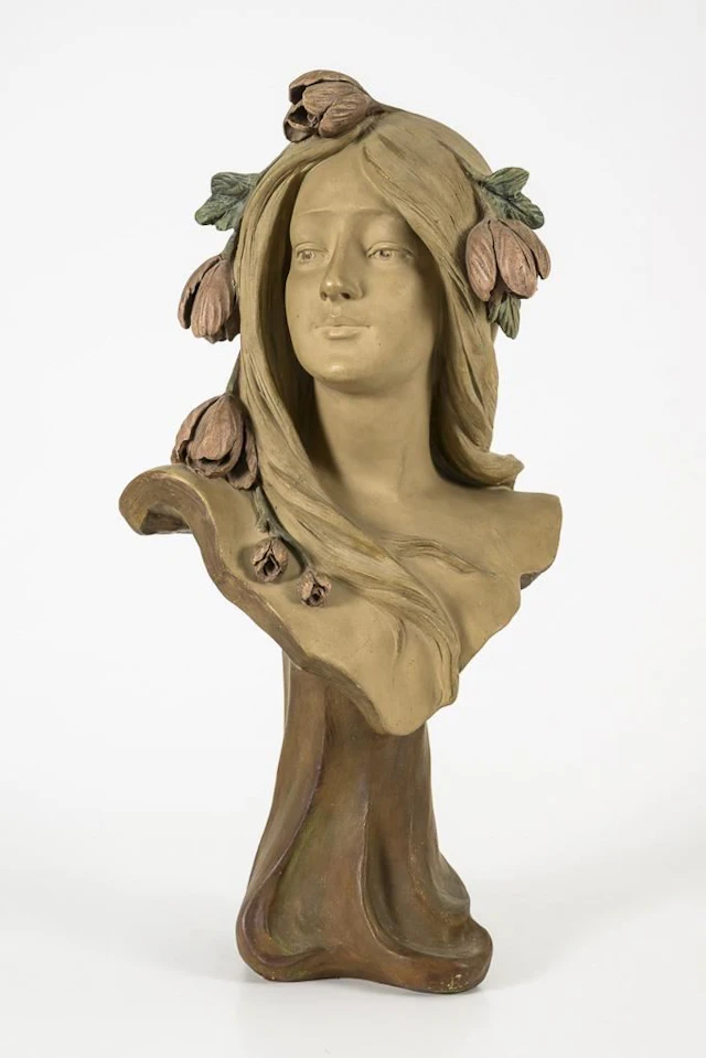 Art Nouveau bust of a nymph adorned with tulips.