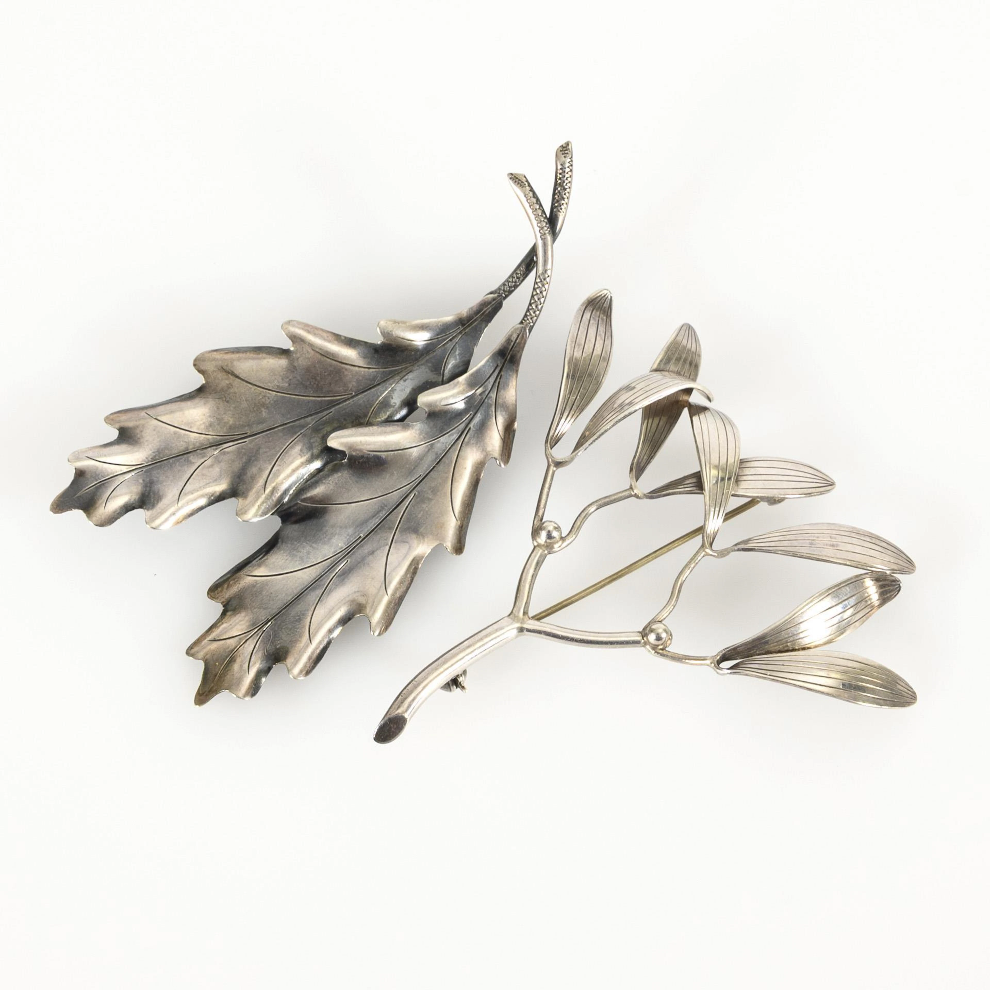 2 midcentury designer silver brooches mistletoe (GERTRUD ENGEL) and oak leaves.
