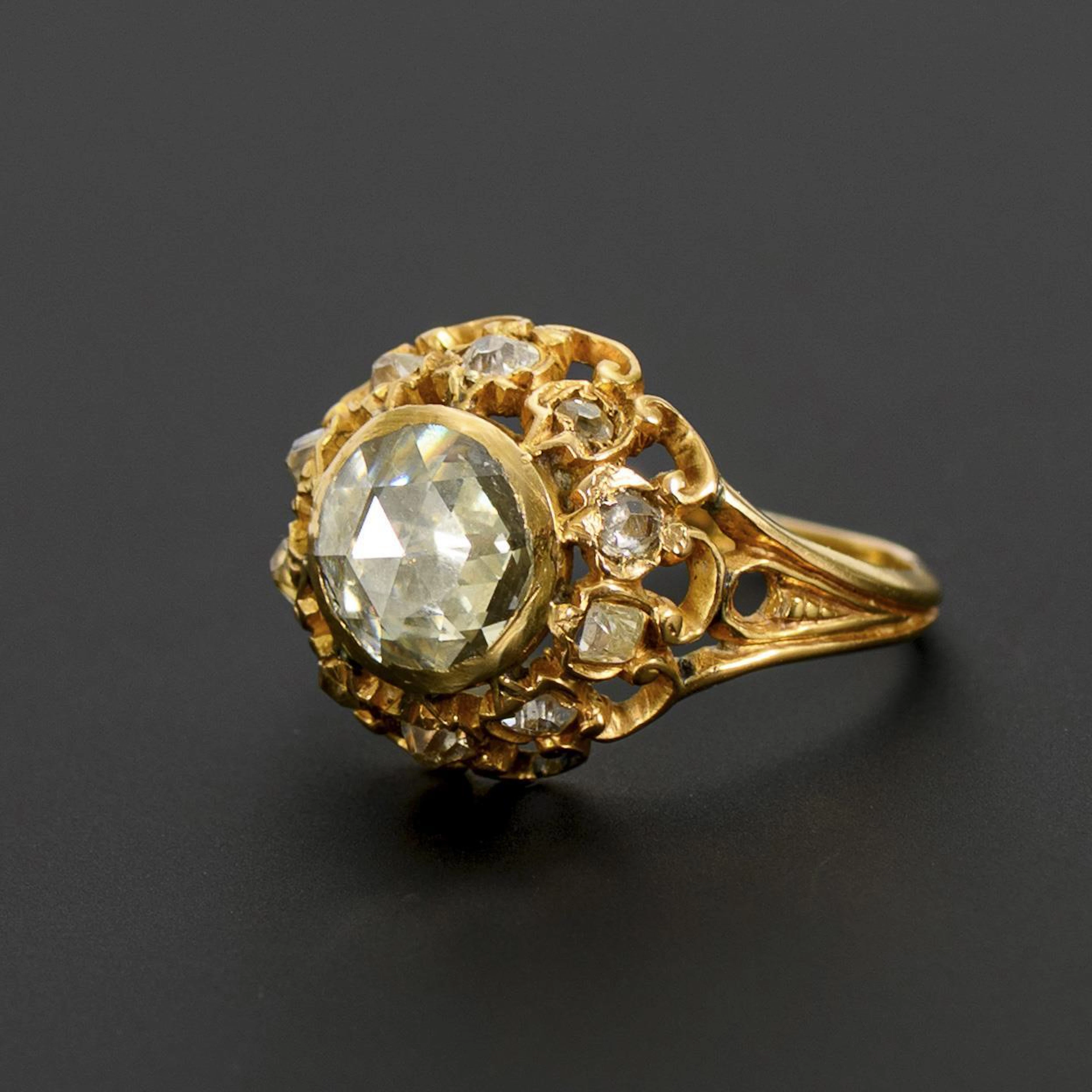 Ring with large, historic rose-cut diamond.