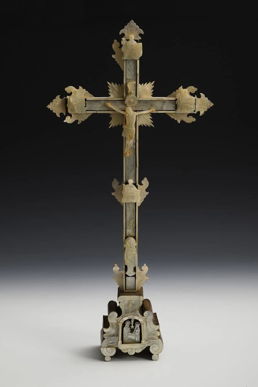 Crucifix with mother-of-pearl inlays and reliefs.