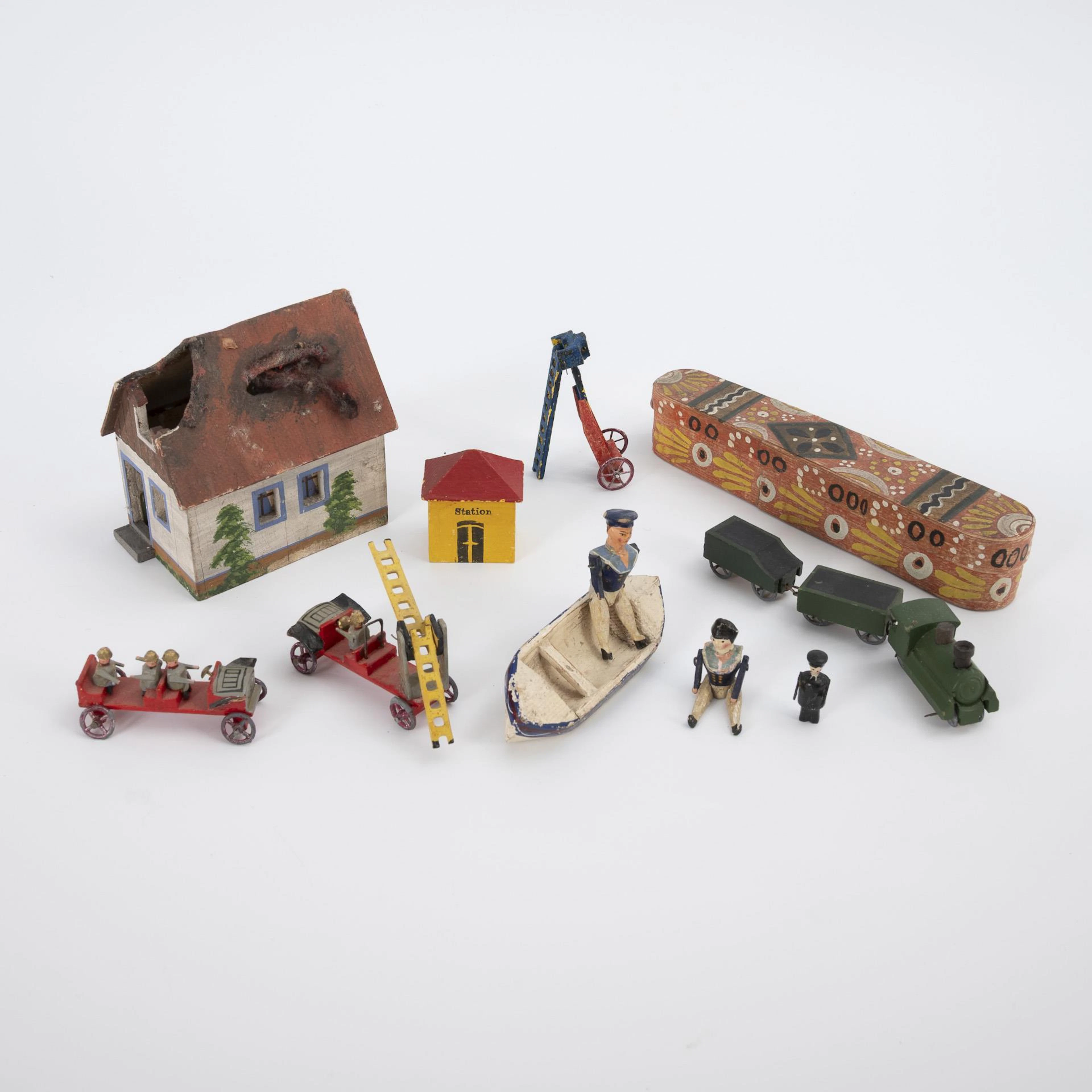 Burning house, fire department, locomotive and rowing boat.