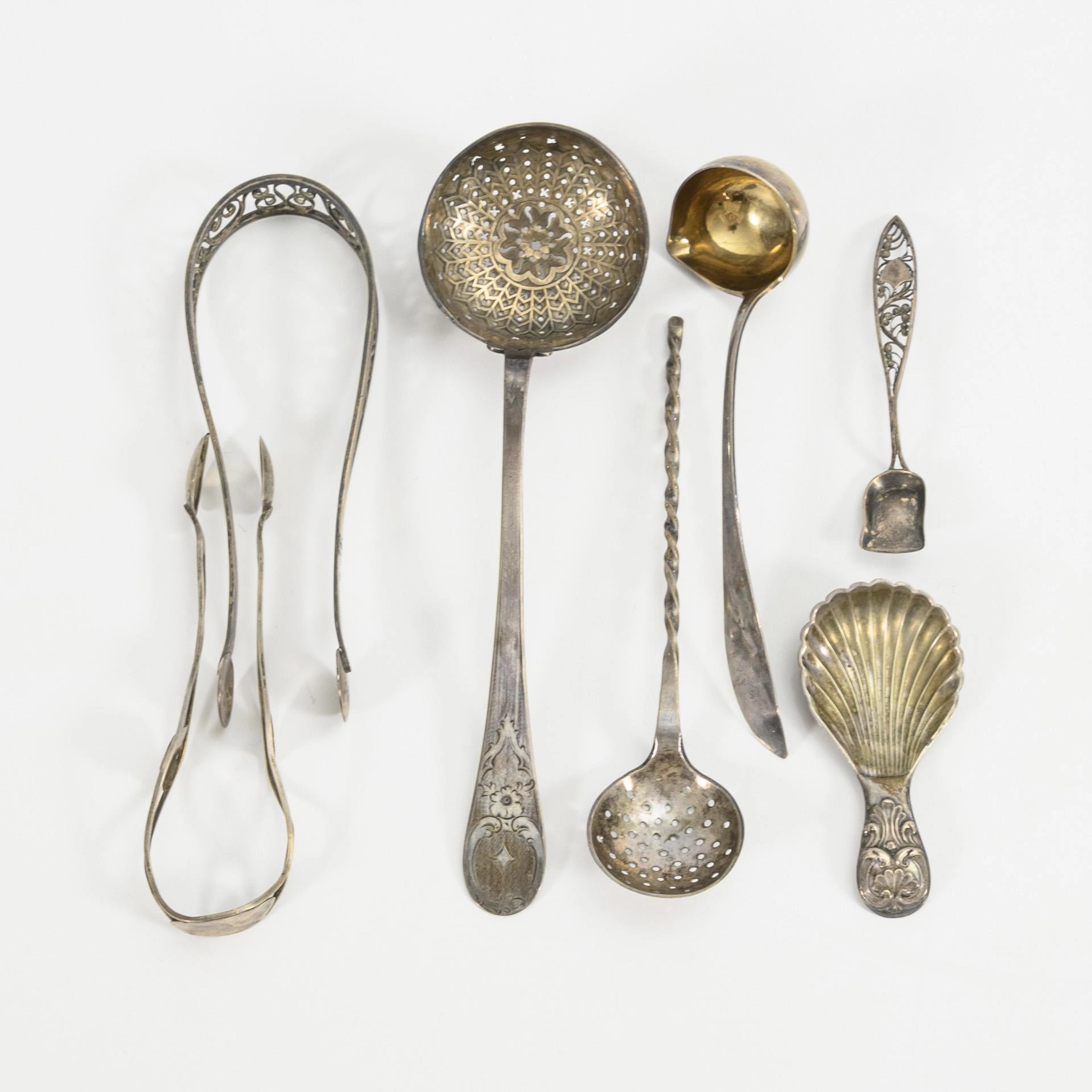 7 Biedermeier silver utensils for the coffee table.