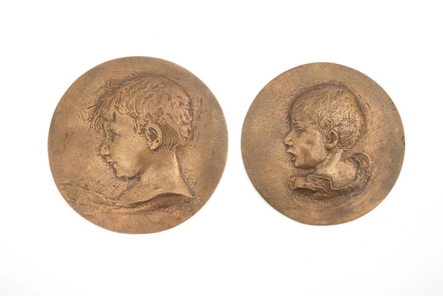 2 bronze medals with children's heads