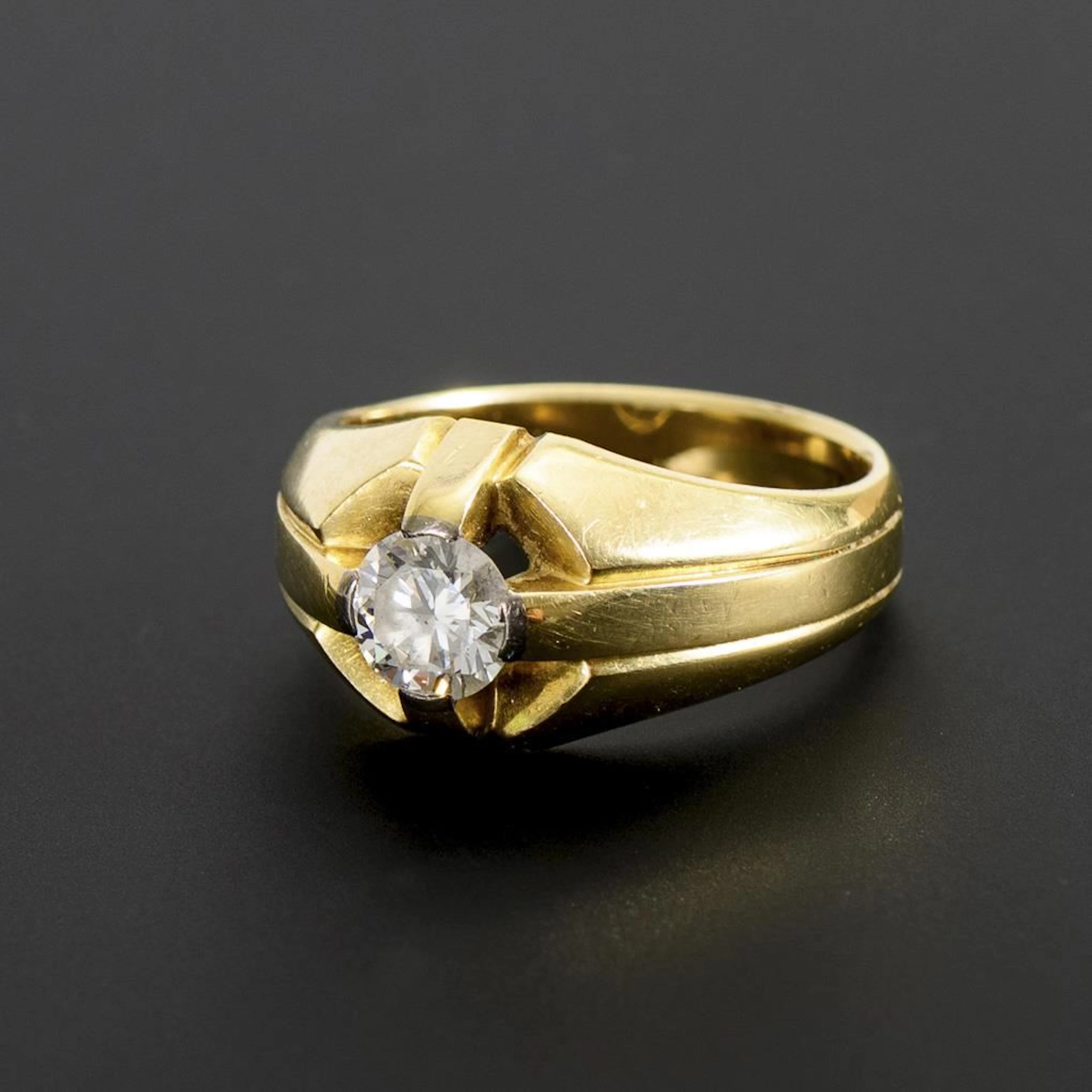 Ring with a large solitaire diamond.