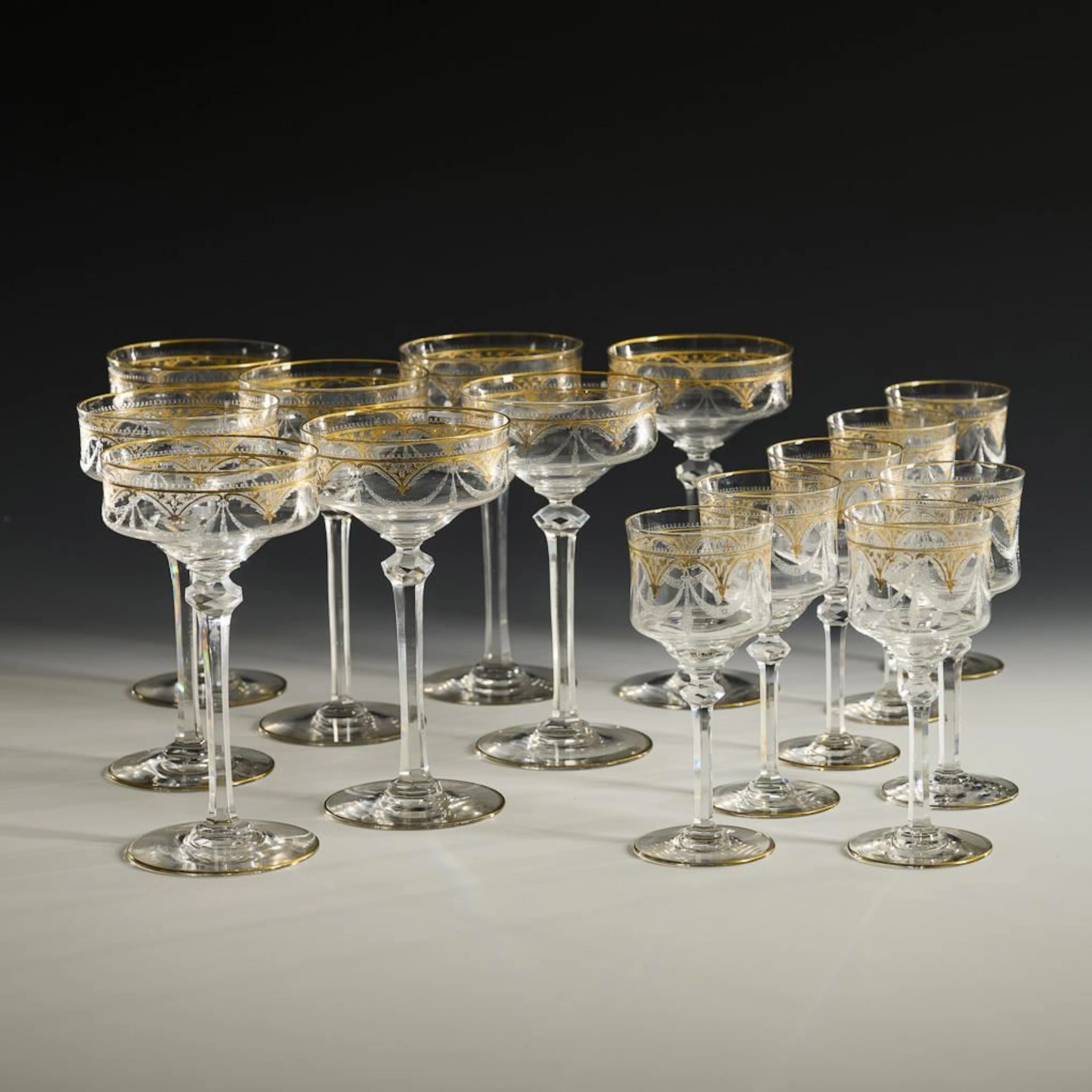 8 champagne glasses and 7 red wine glasses.