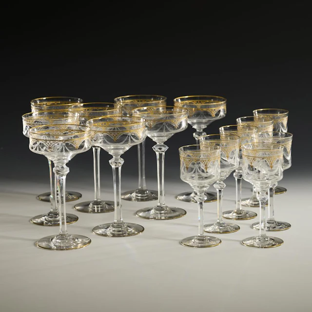 8 champagne glasses and 7 red wine glasses.