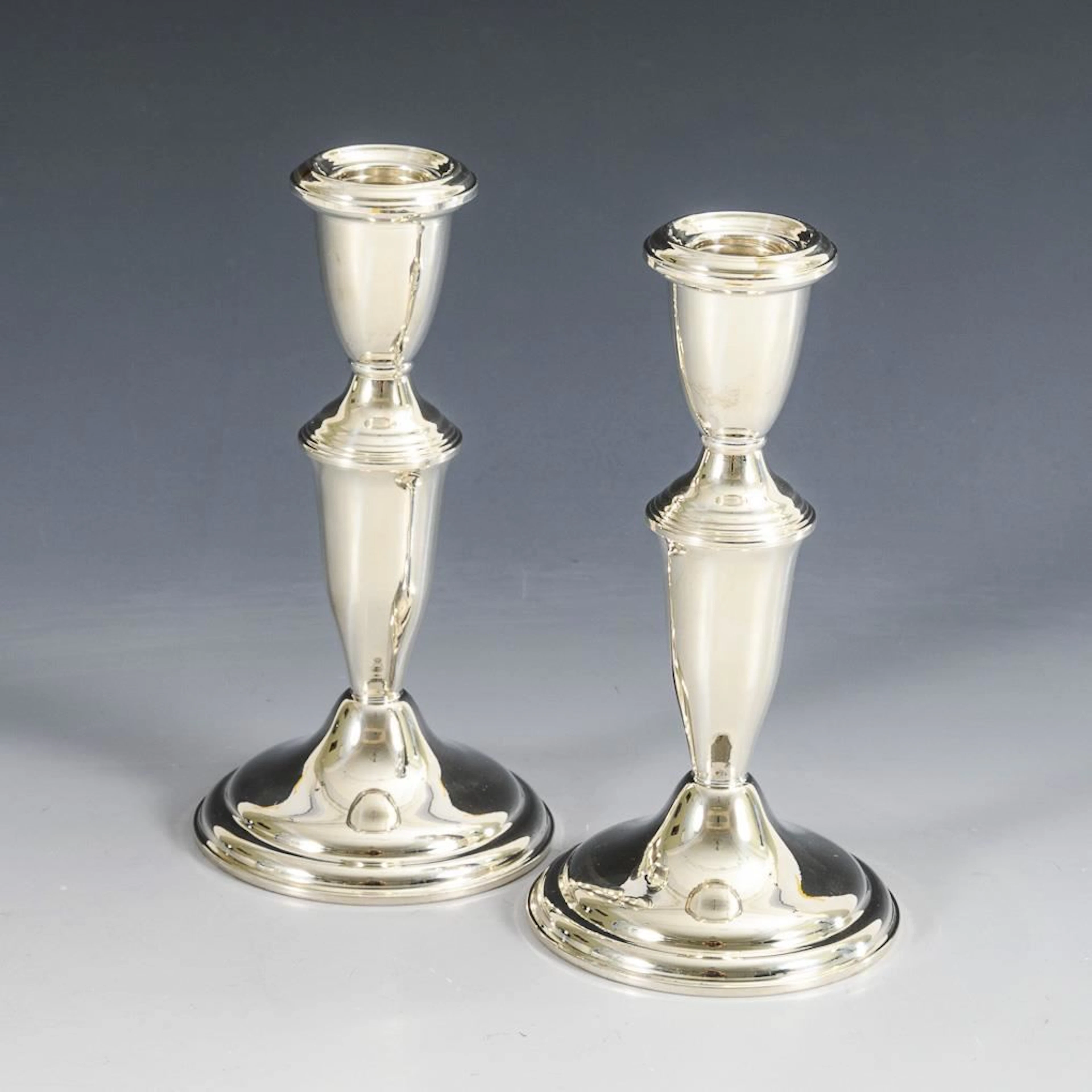 Pair of simple silver candlesticks. Empire Sterling.