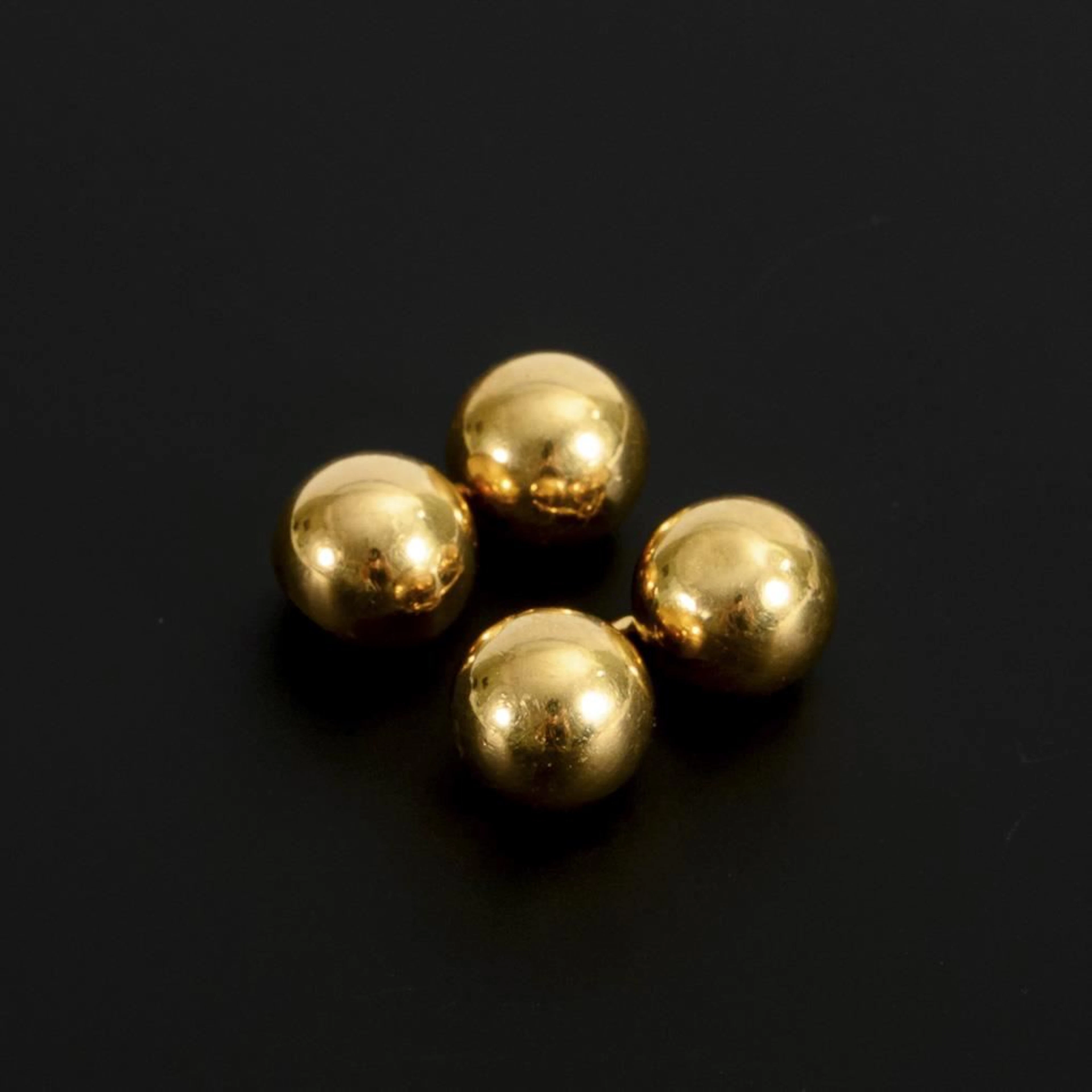 Cufflinks with spherical heads.