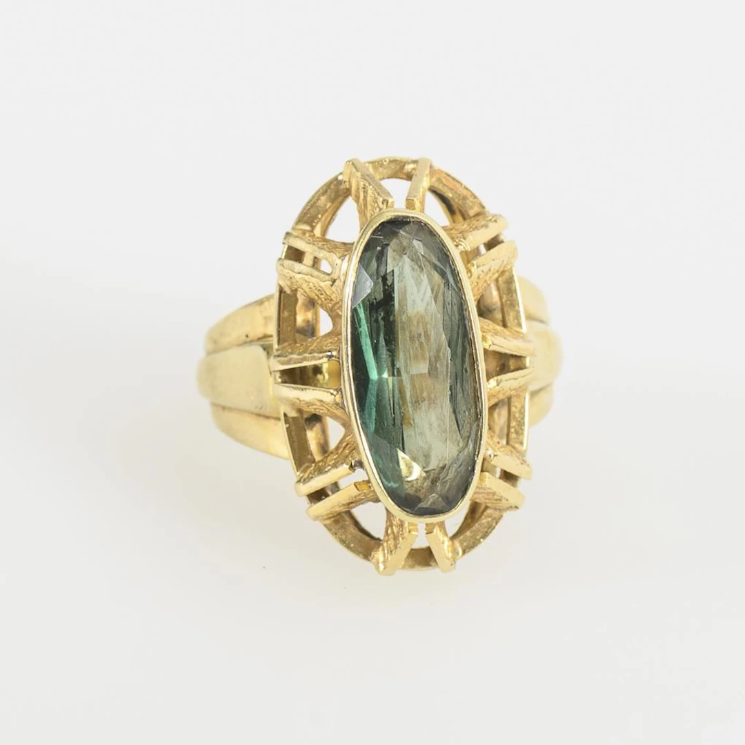 Ring with a green gemstone.