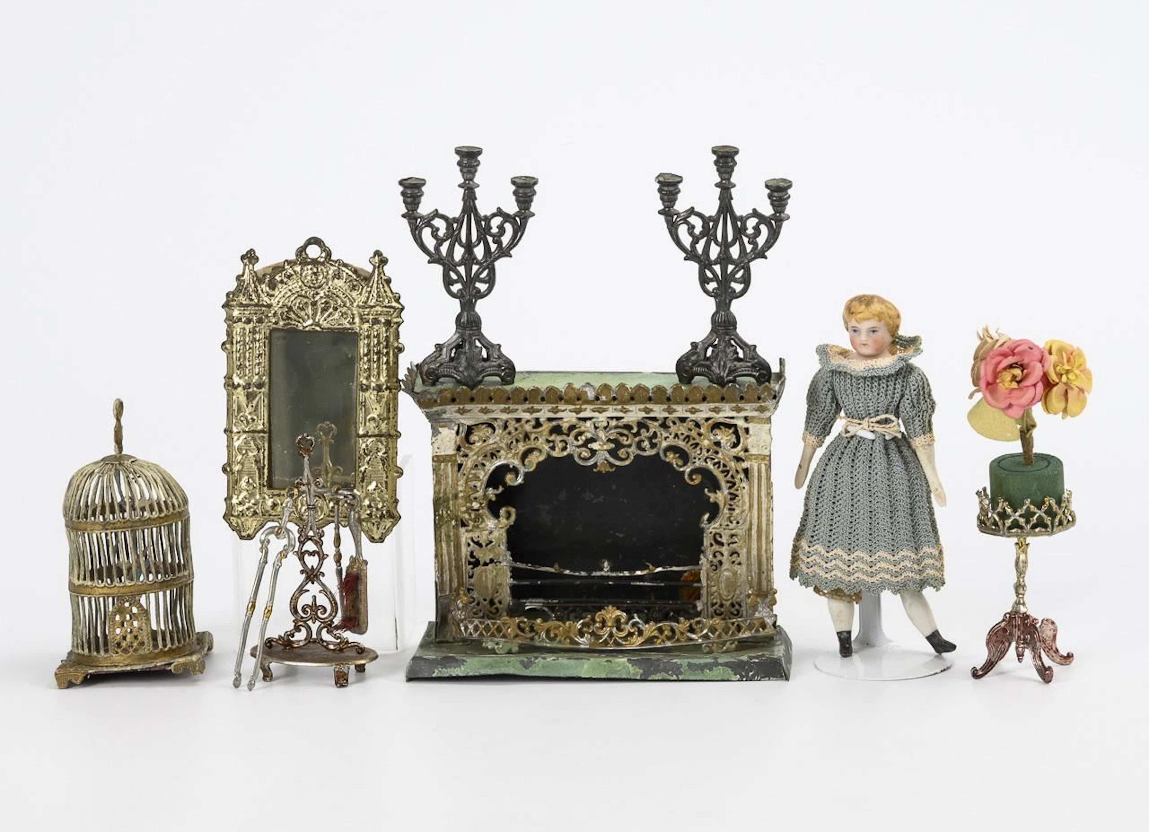 Fine dollhouse accessories made of pewter, including a mirror and