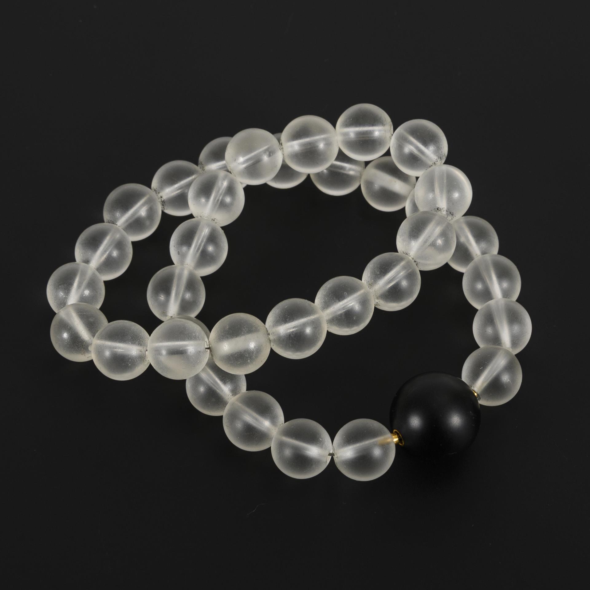 Necklace with 34 rock crystal spheres.