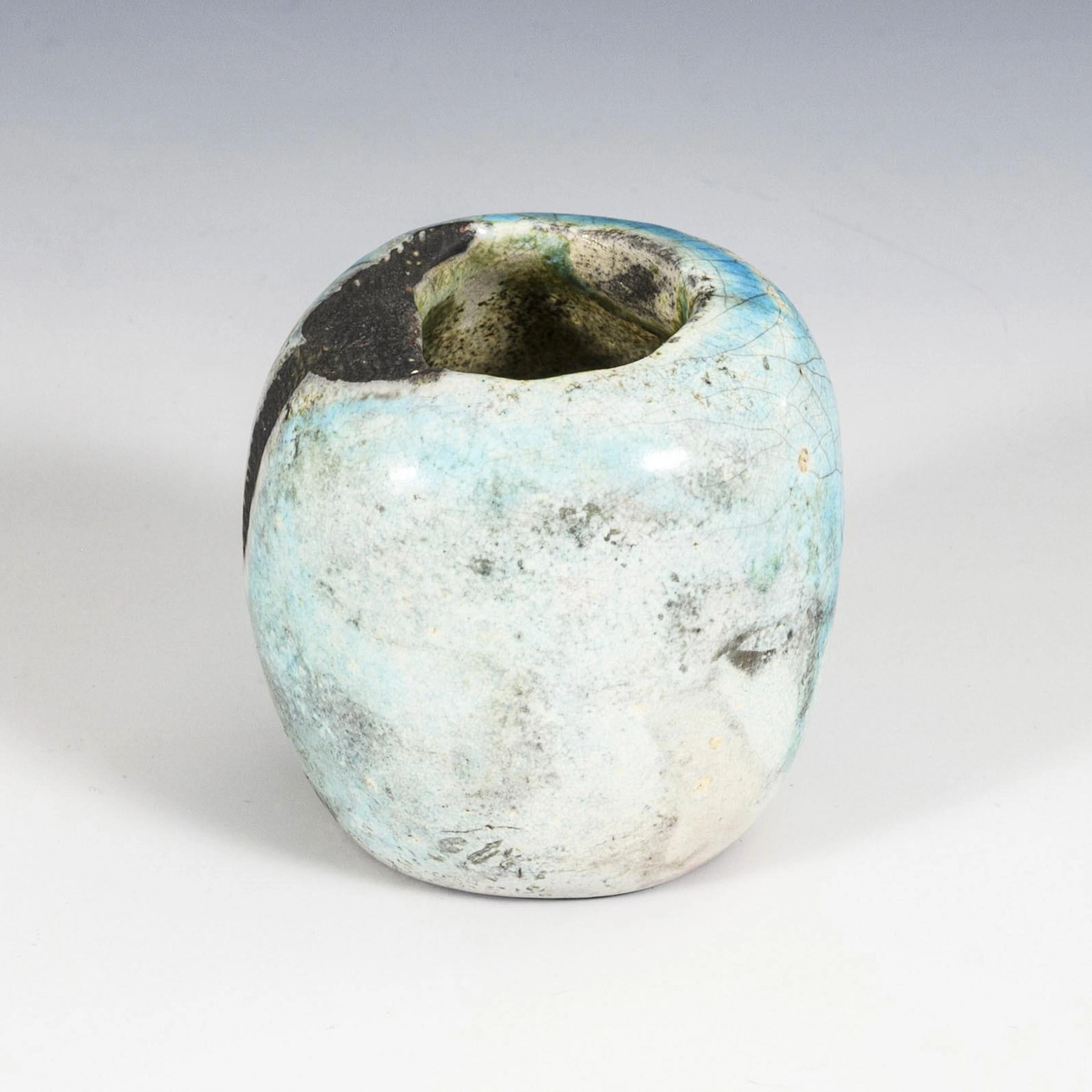 Small bluish vase.