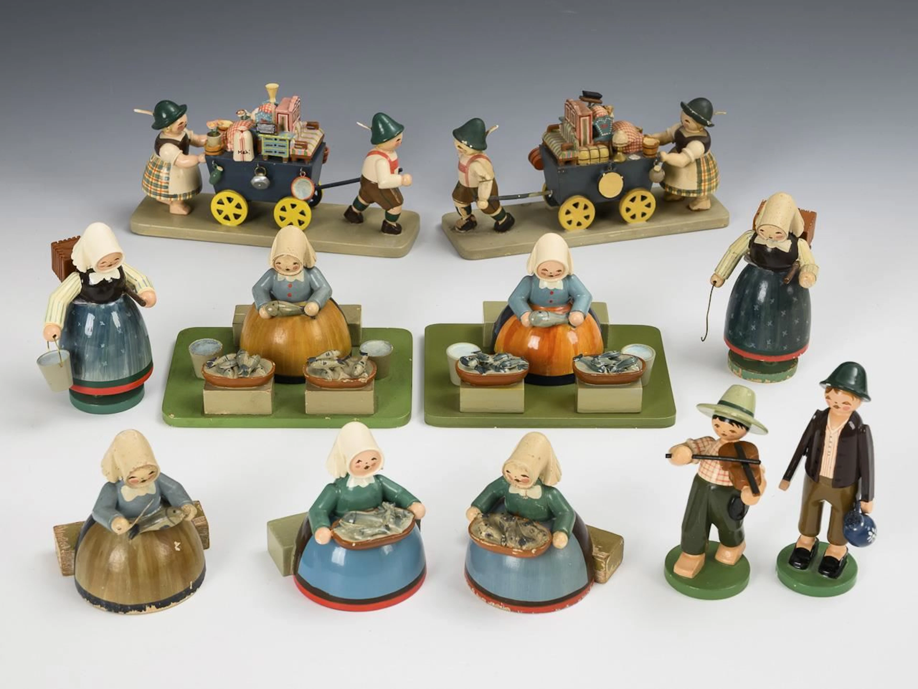Set of 11 figurines, including fishmongers. Wendt & Kühn.