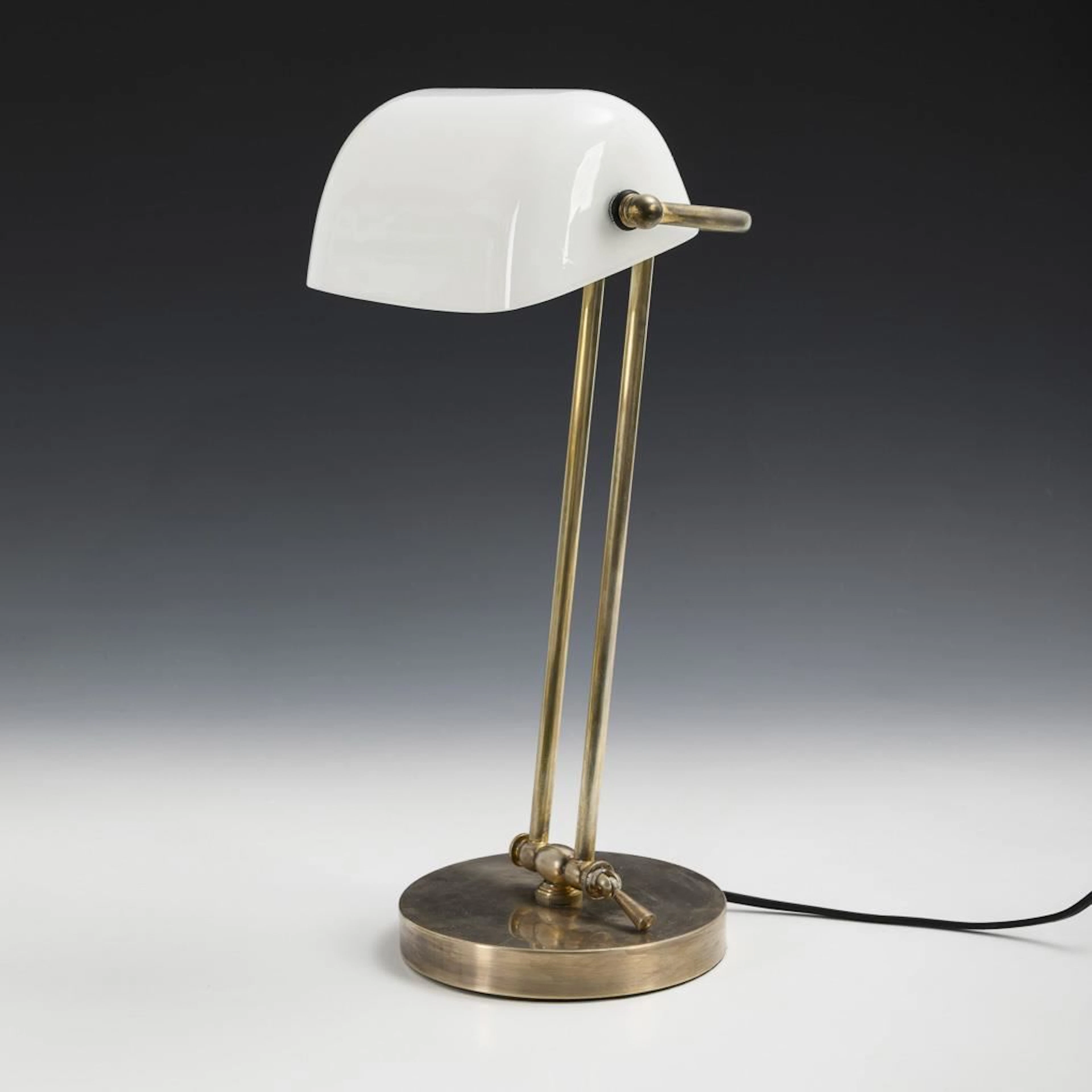 Art Deco desk lamp with white shade.